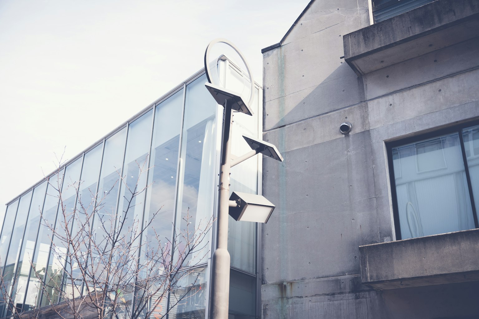 Contrast of modern building and simple street sign
