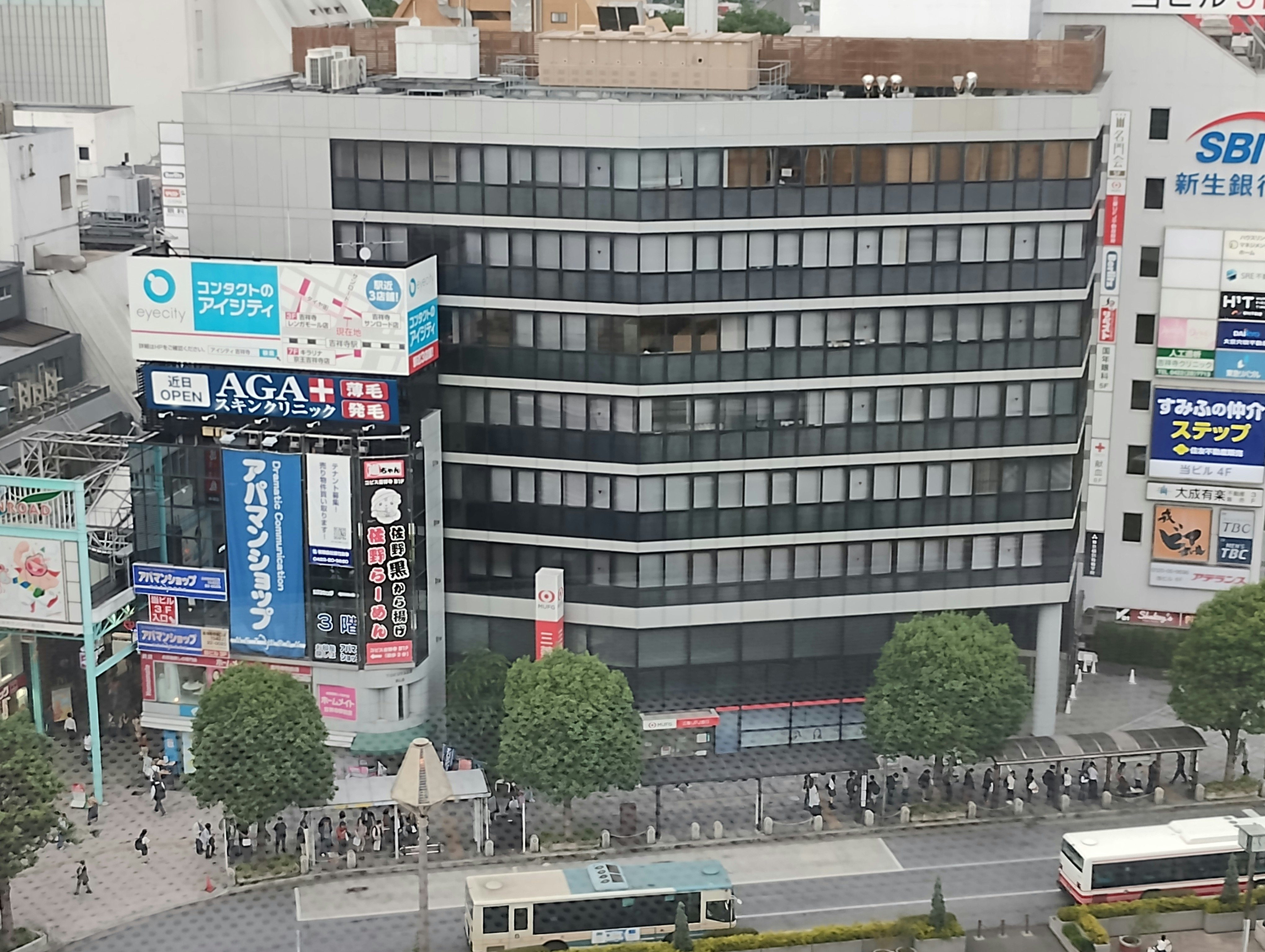 urban street scene with a busy intersection and storefront signage