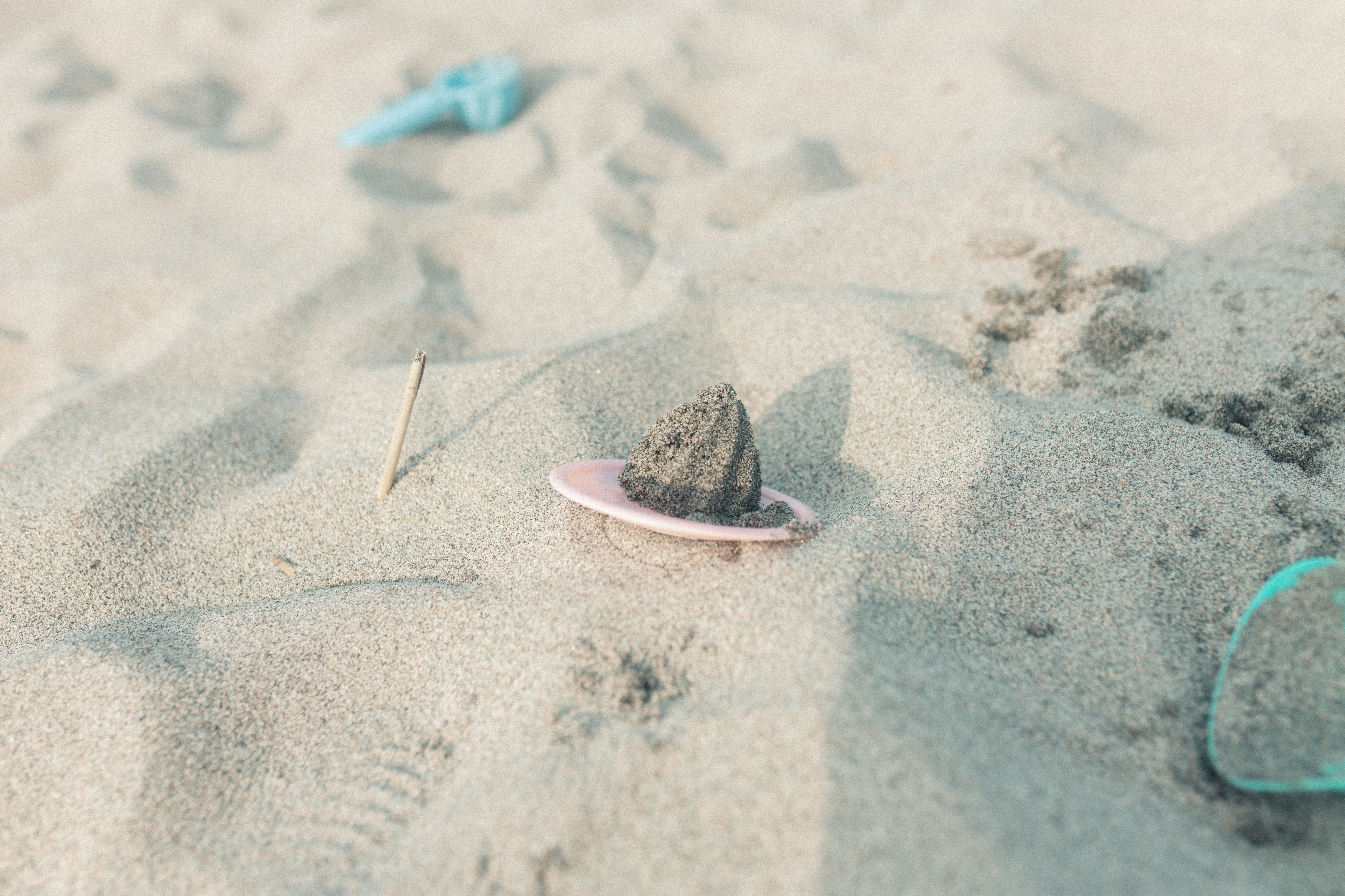 Seashell and colorful beach items on sand