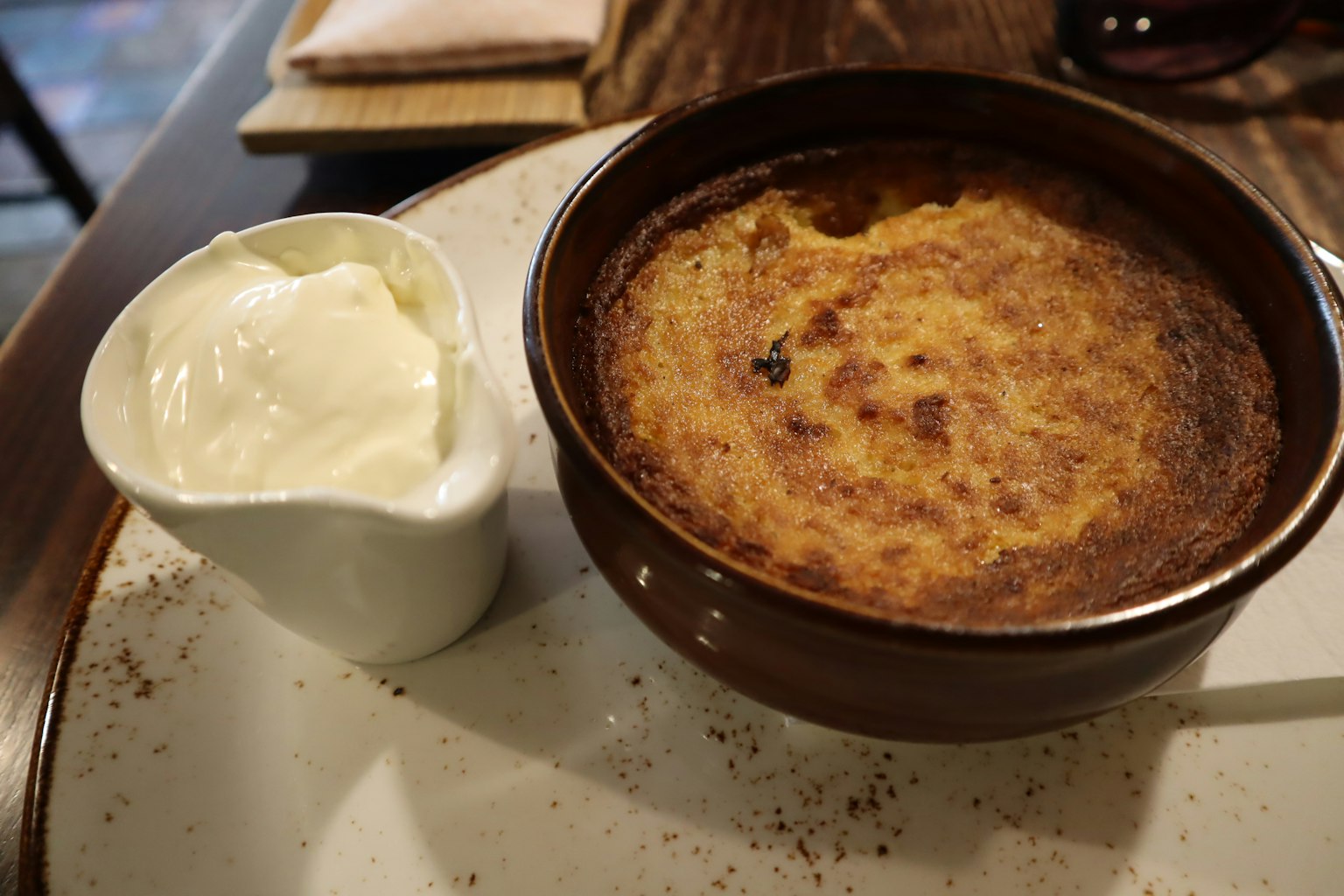 Creamy dessert with a side of sour cream