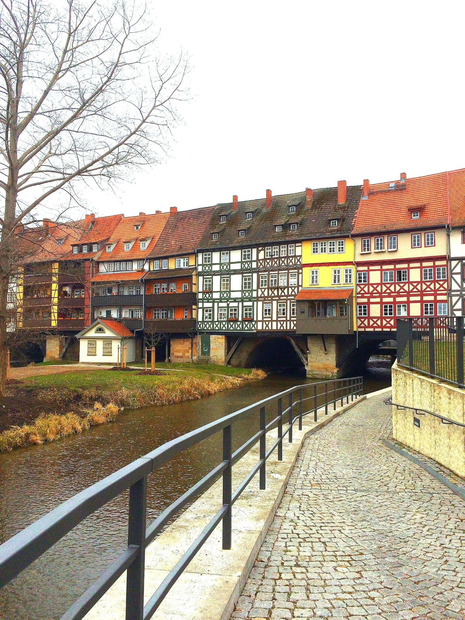 Picturesque riverside view with timber-framed houses