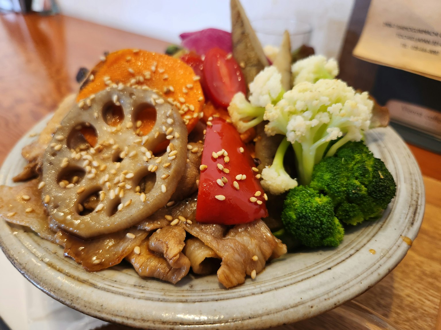 A vibrant plate of assorted vegetables and meat beautifully arranged