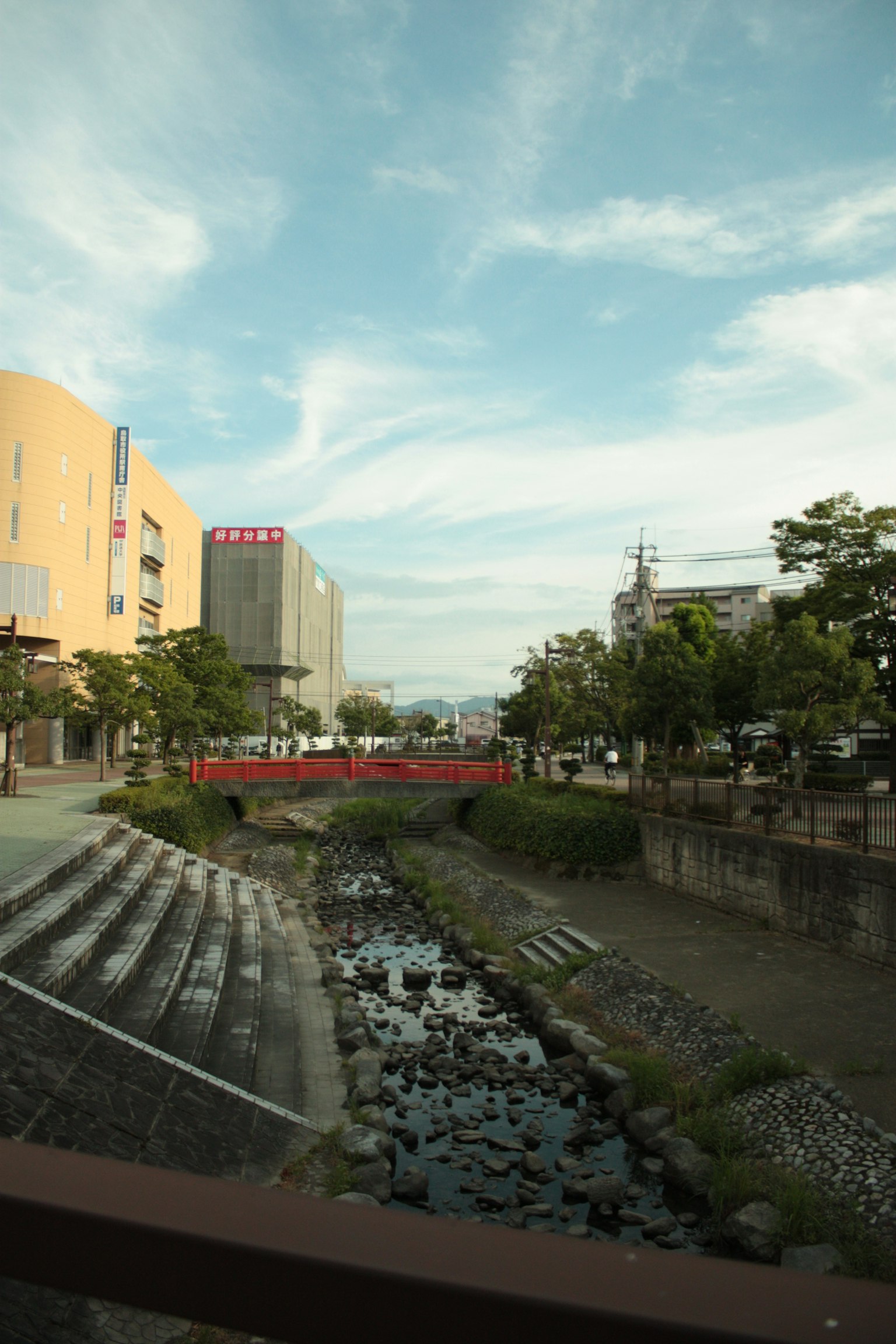 Urban landscape featuring a river and bridge