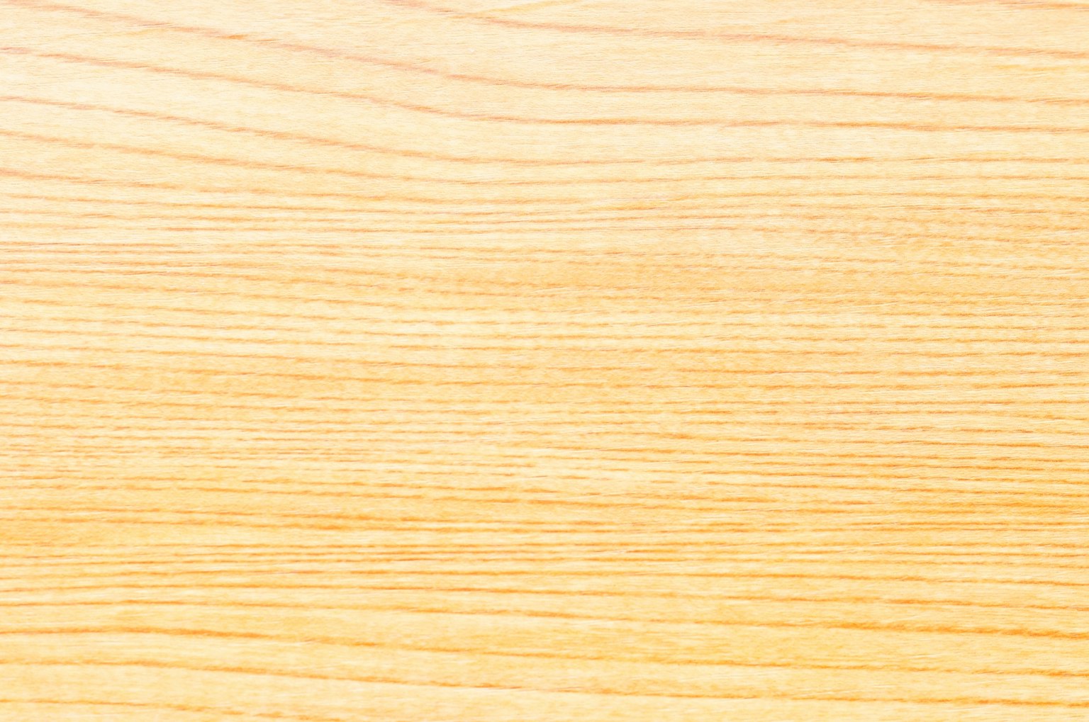 Superficie de madera clara con patrones de grano visibles