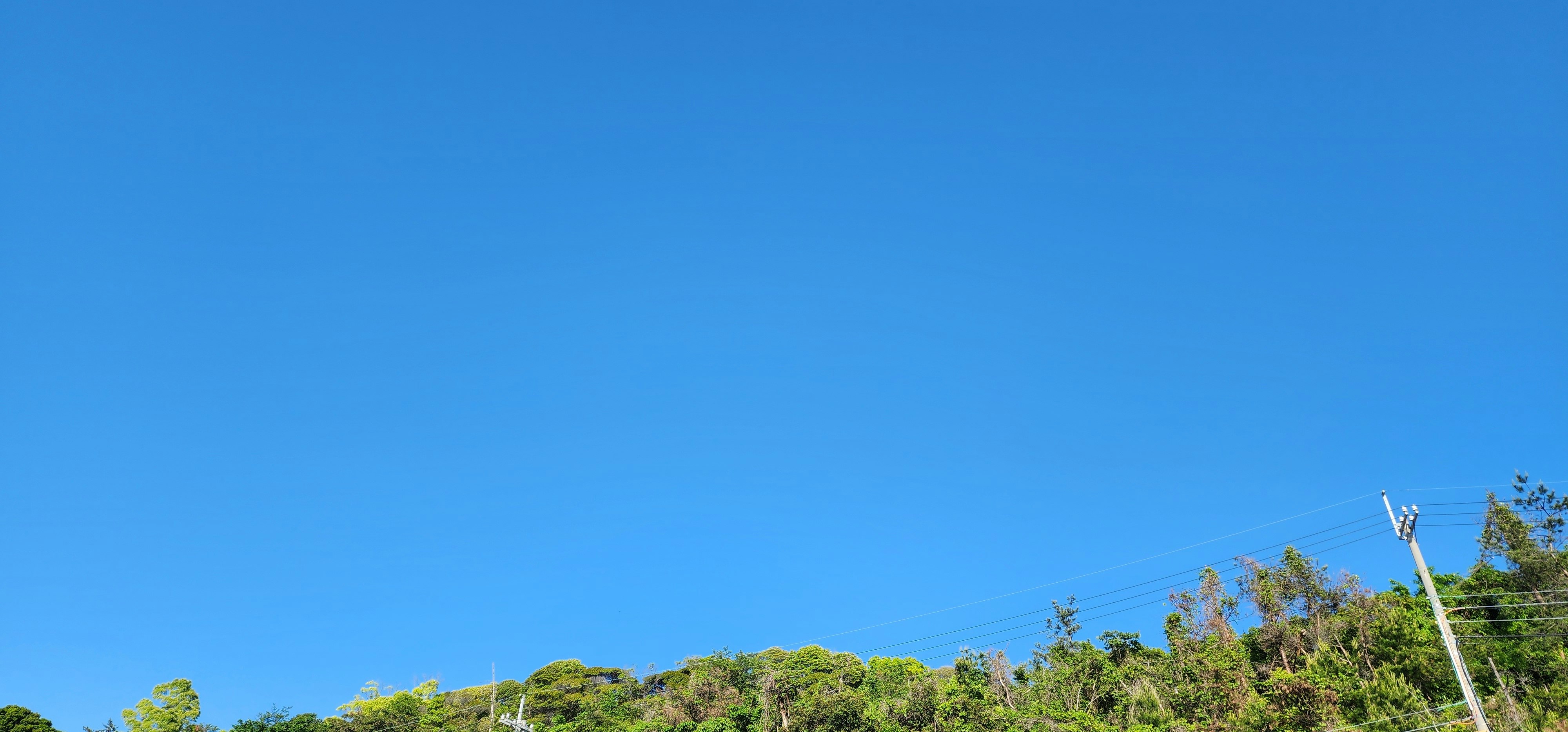 vast blue sky over green hills