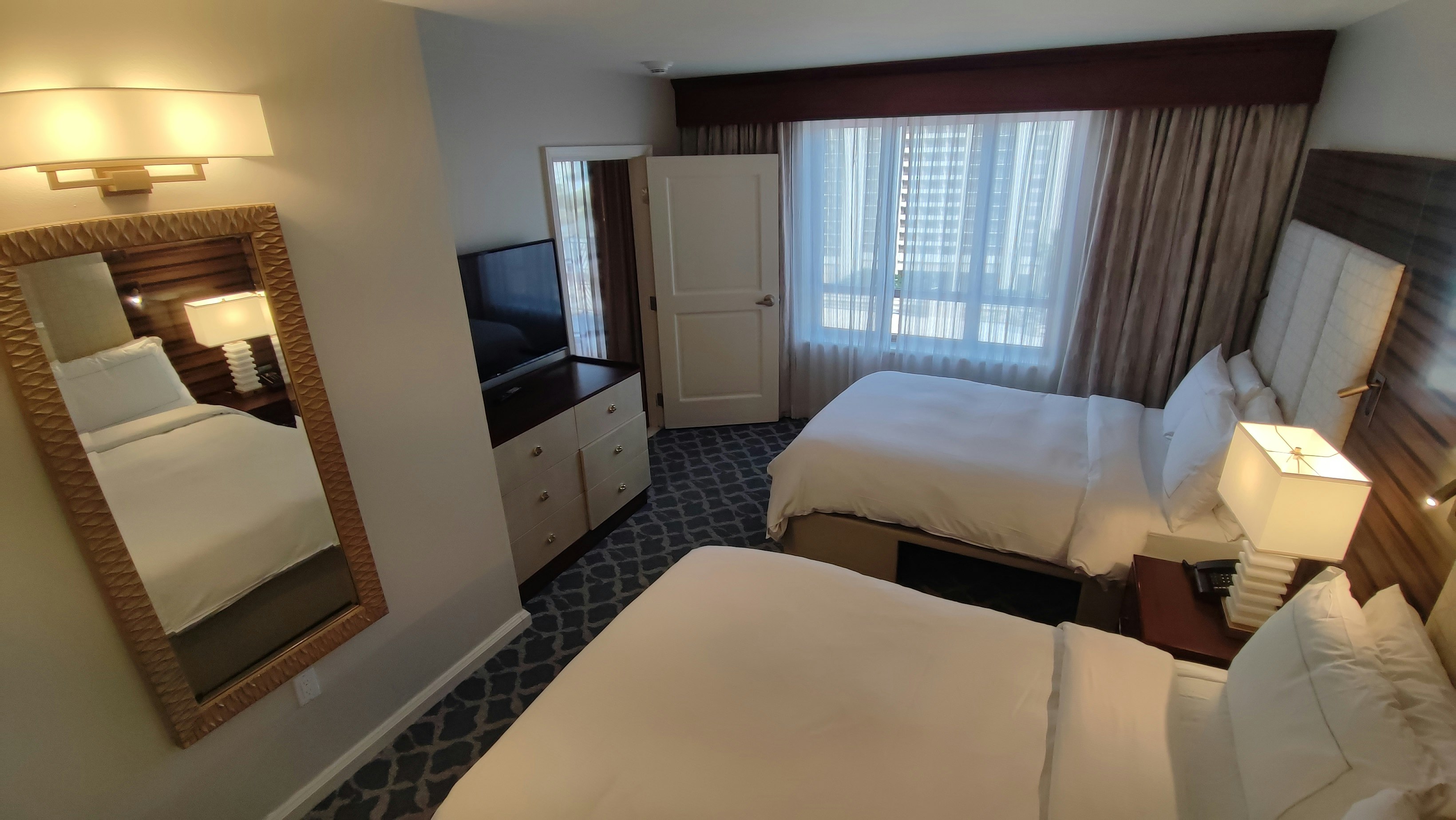 hotel bedroom with bed and bedside lamps