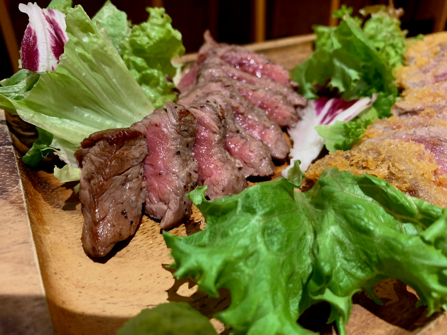 Thinly sliced meat served with fresh lettuce