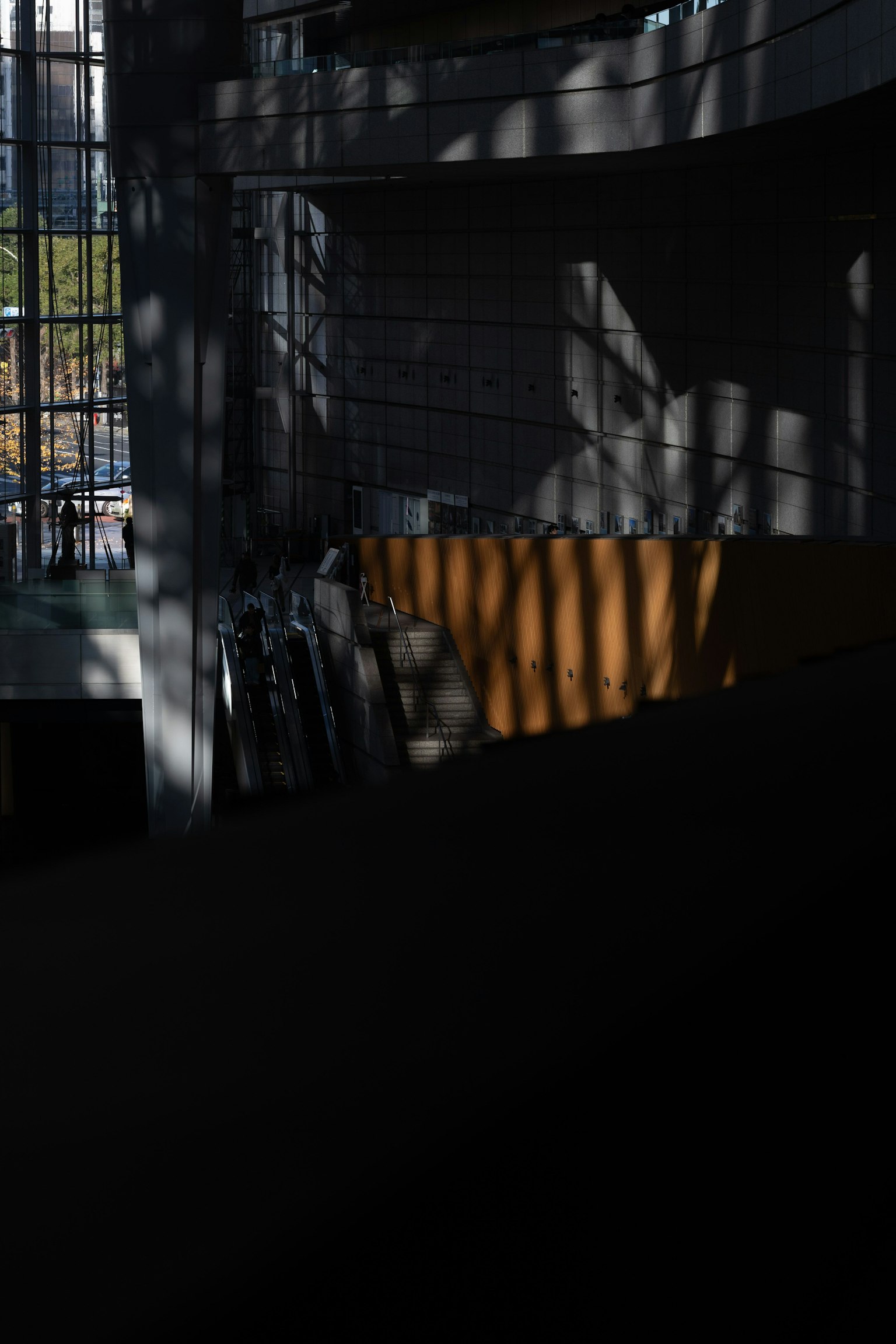 Interior view of a modern building with intersecting shadows