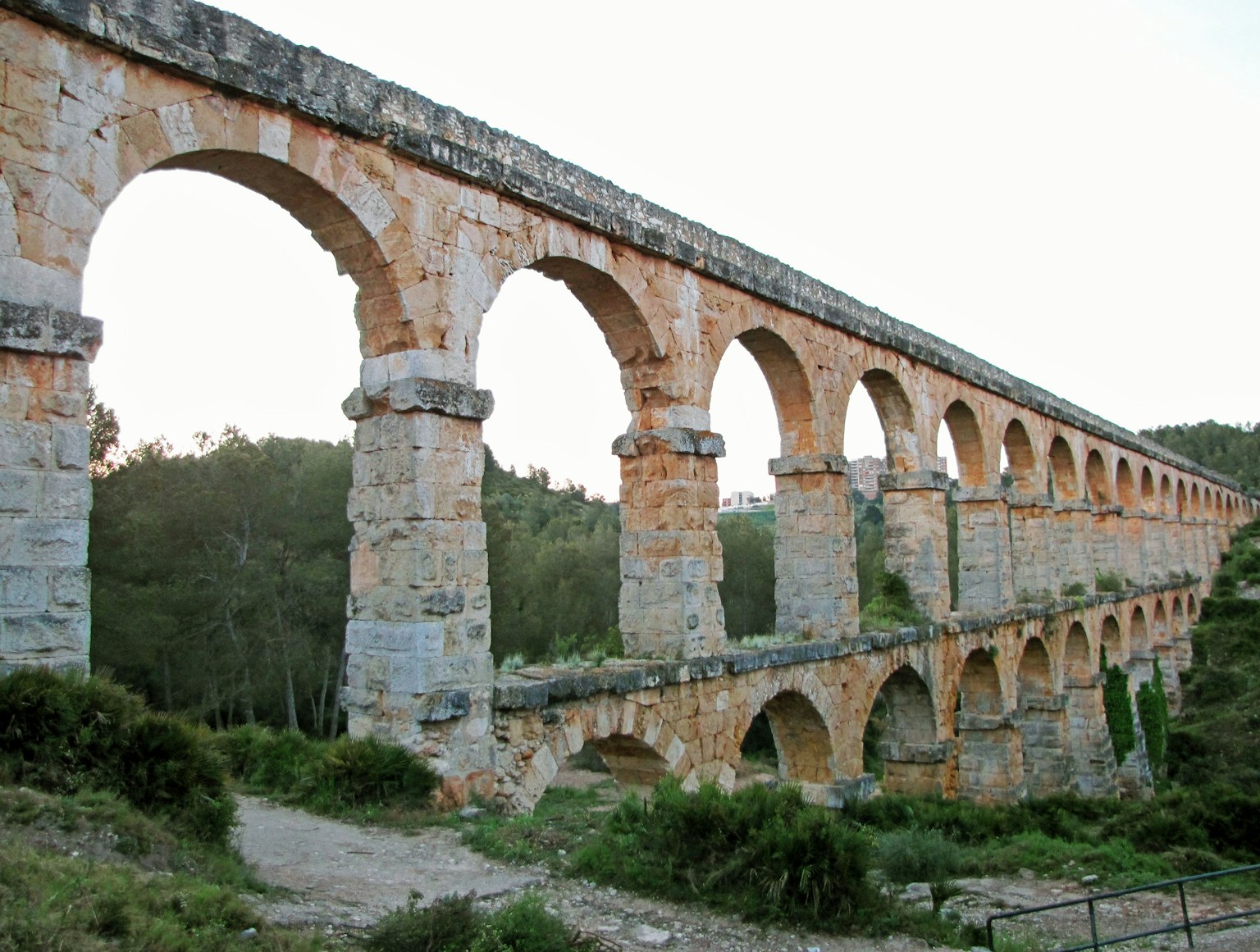 Ancient aqueduct showcasing multiple stone arches