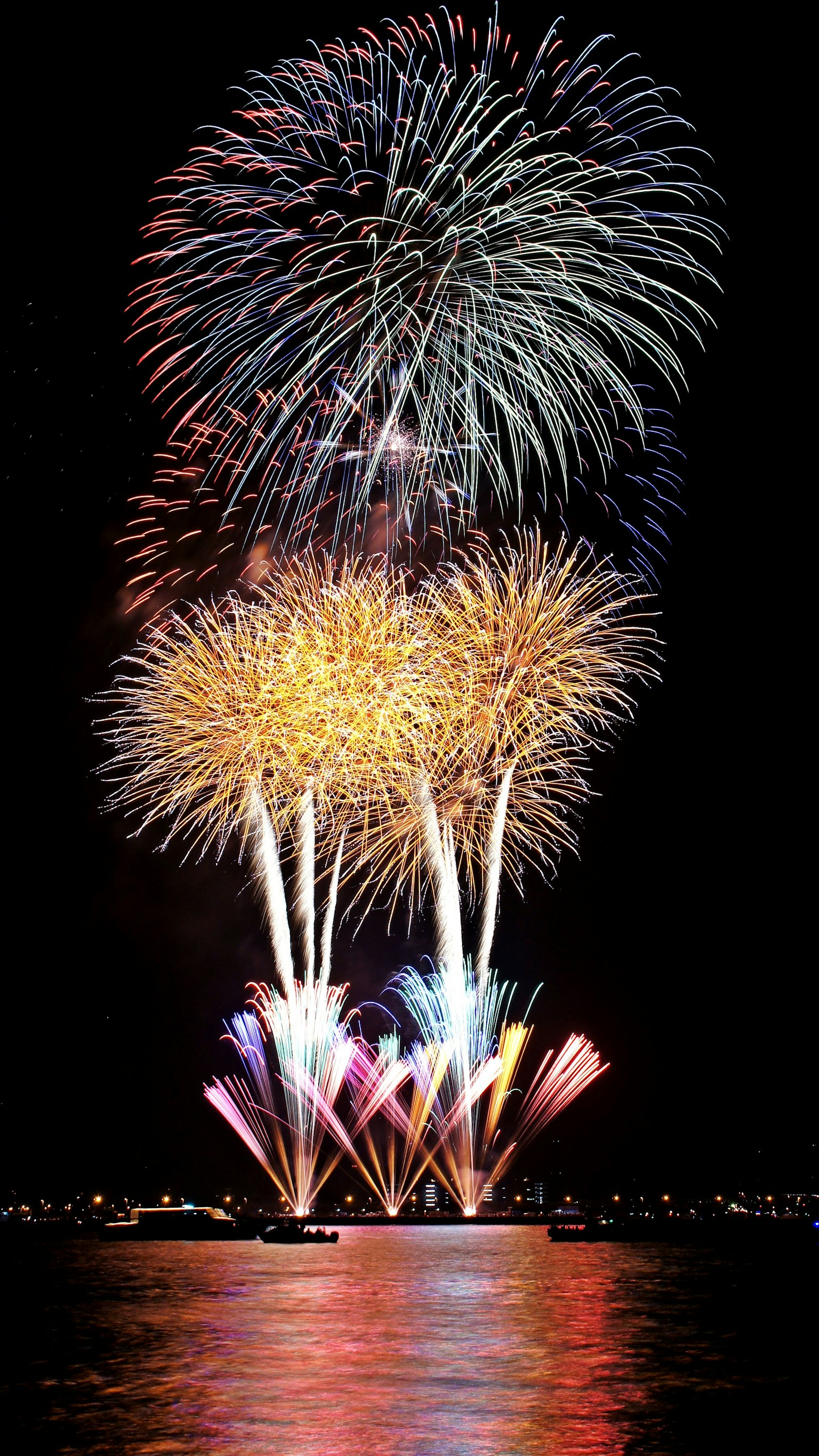 Vibrant fireworks display in the night sky with colorful bursts