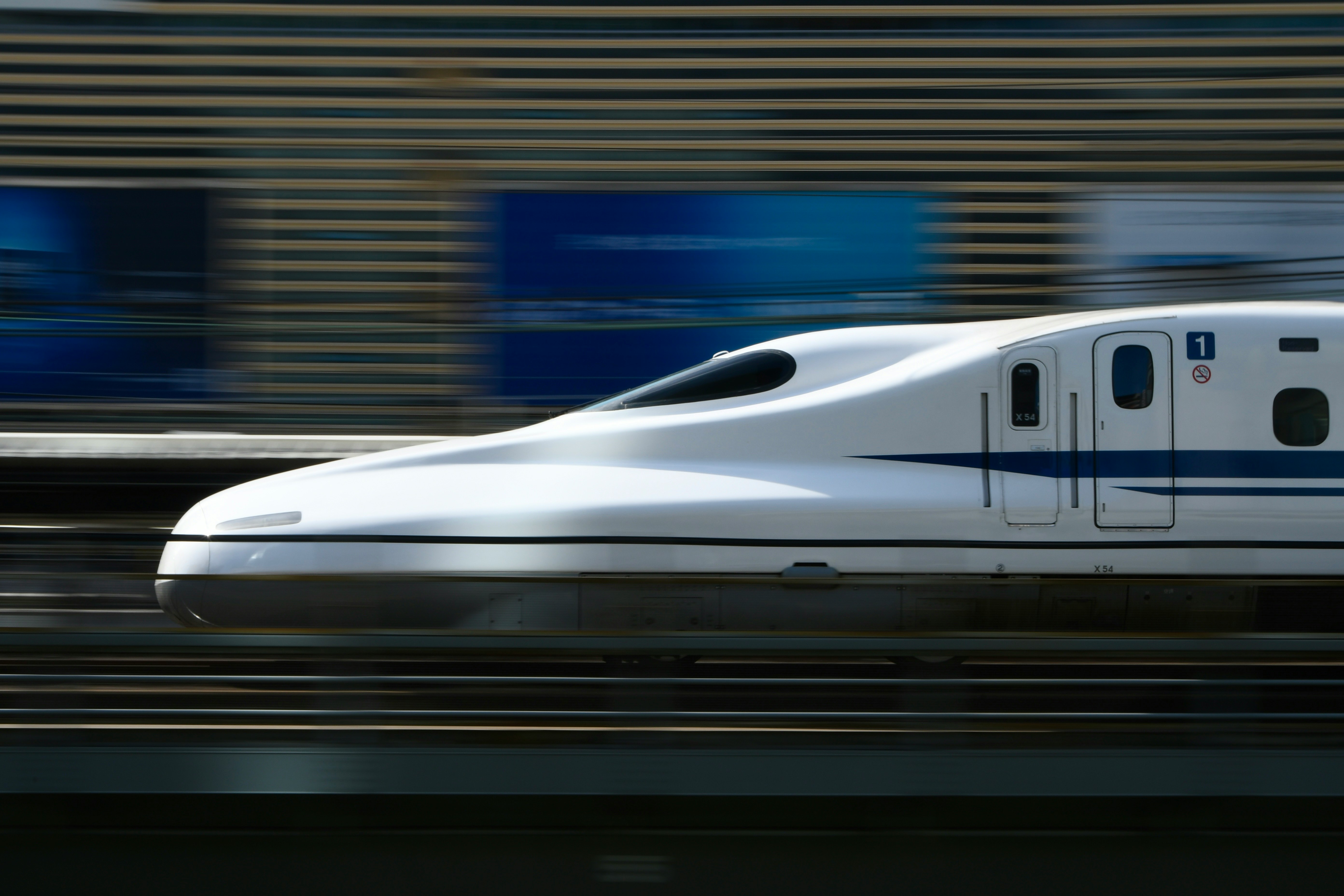 side view of a high-speed train racing past