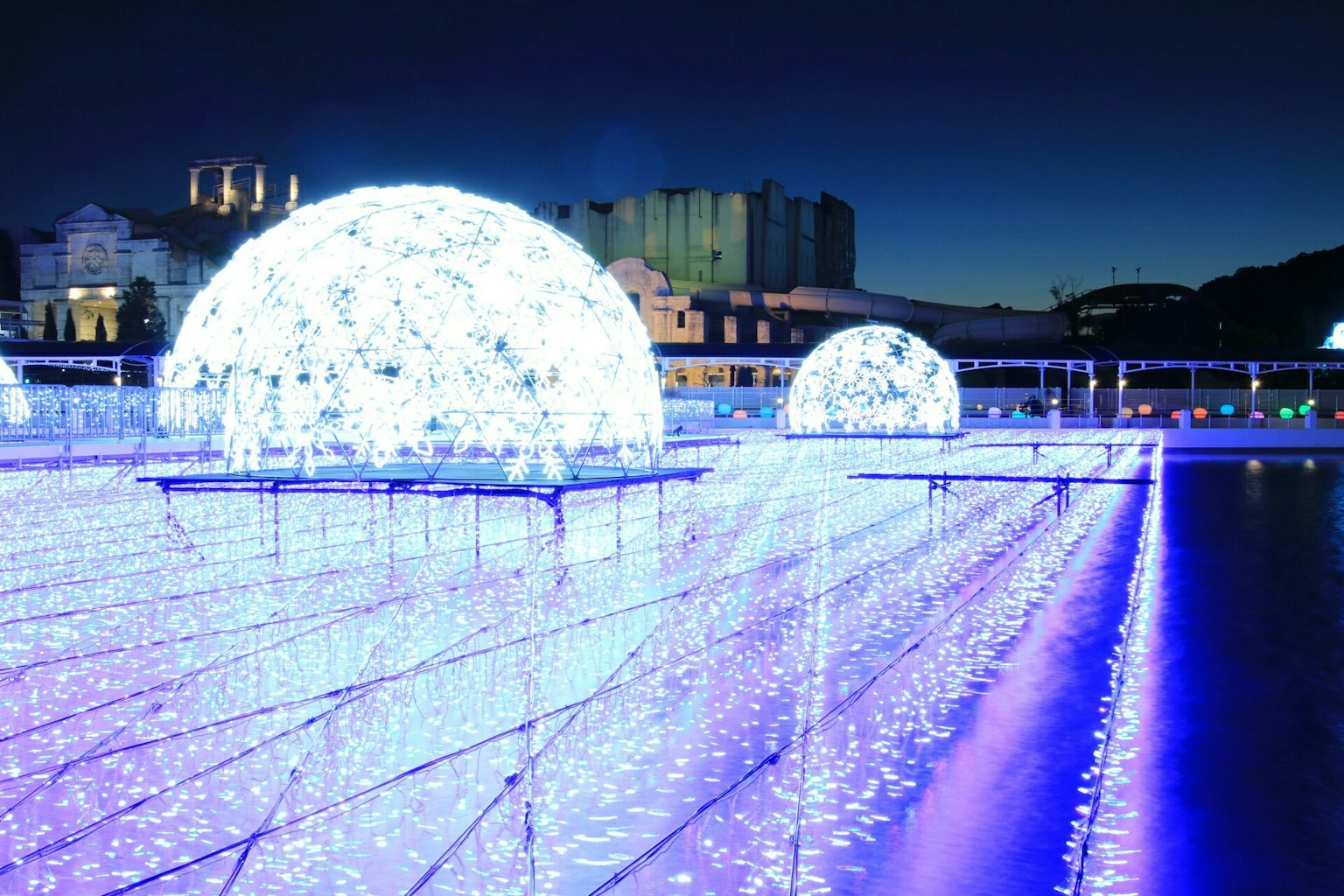 Stunning landscape featuring illuminated blue and white domes at night