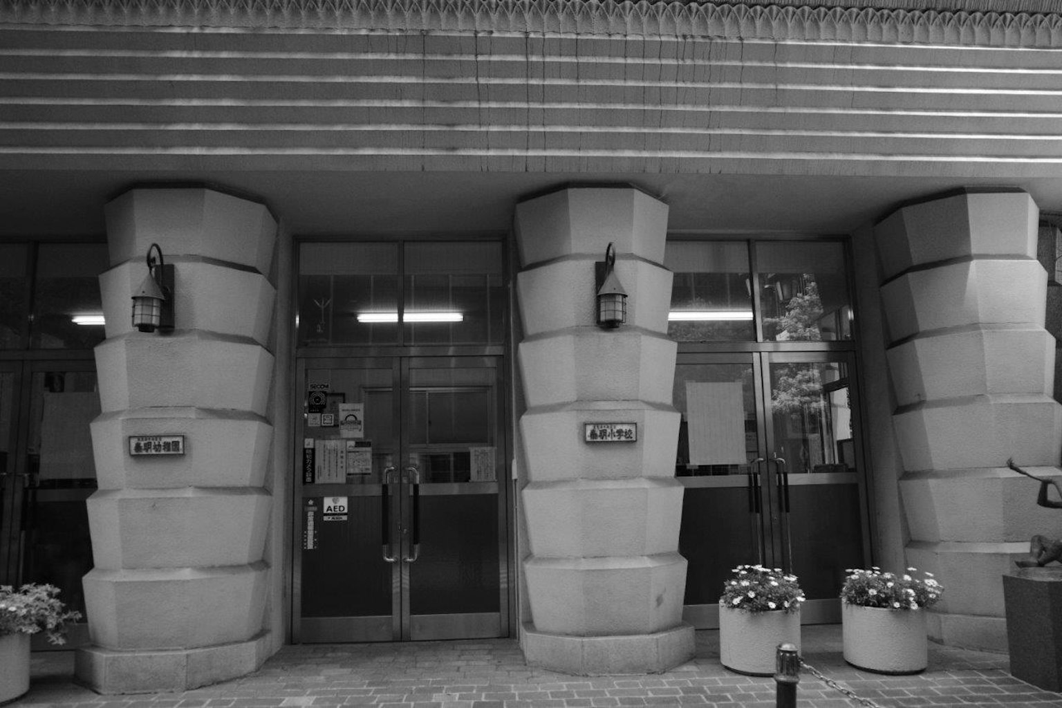 Entrance of a building featuring distinctive columns and doors