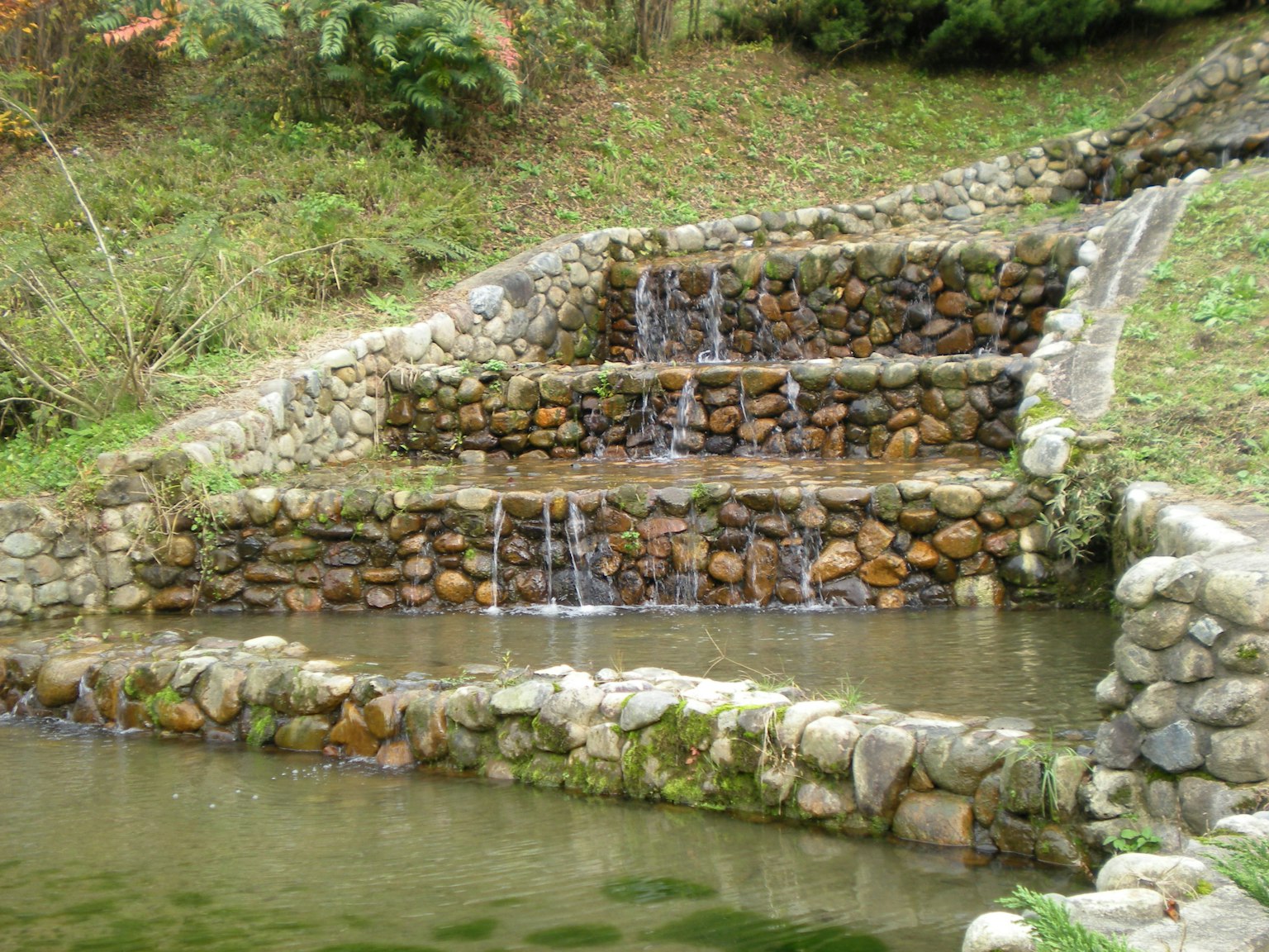 Stone tiered waterfall with flowing water