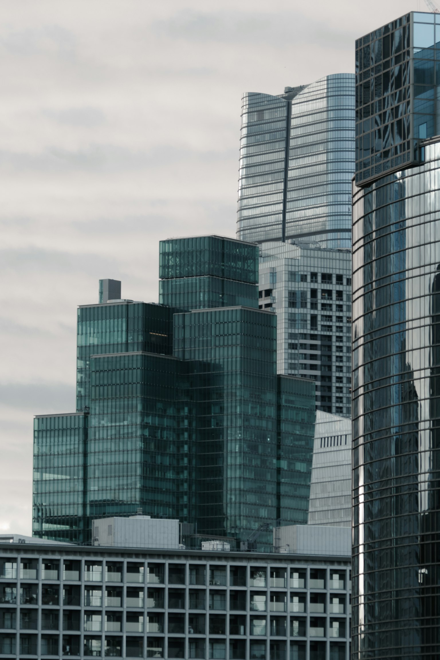 Close-up of a cluster of skyscrapers featuring modern designs and glass facades