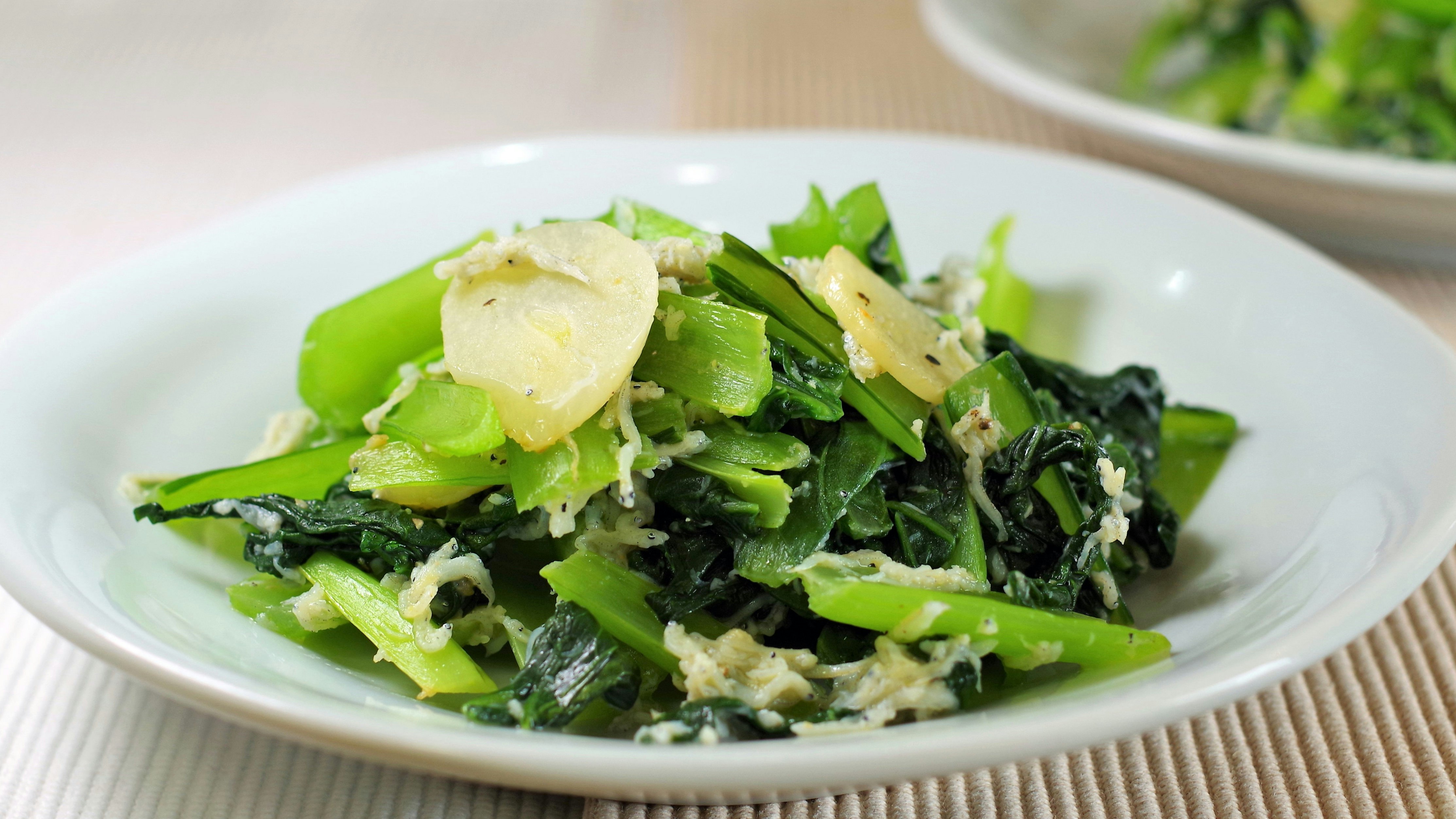 bowl of leafy greens and egg salad