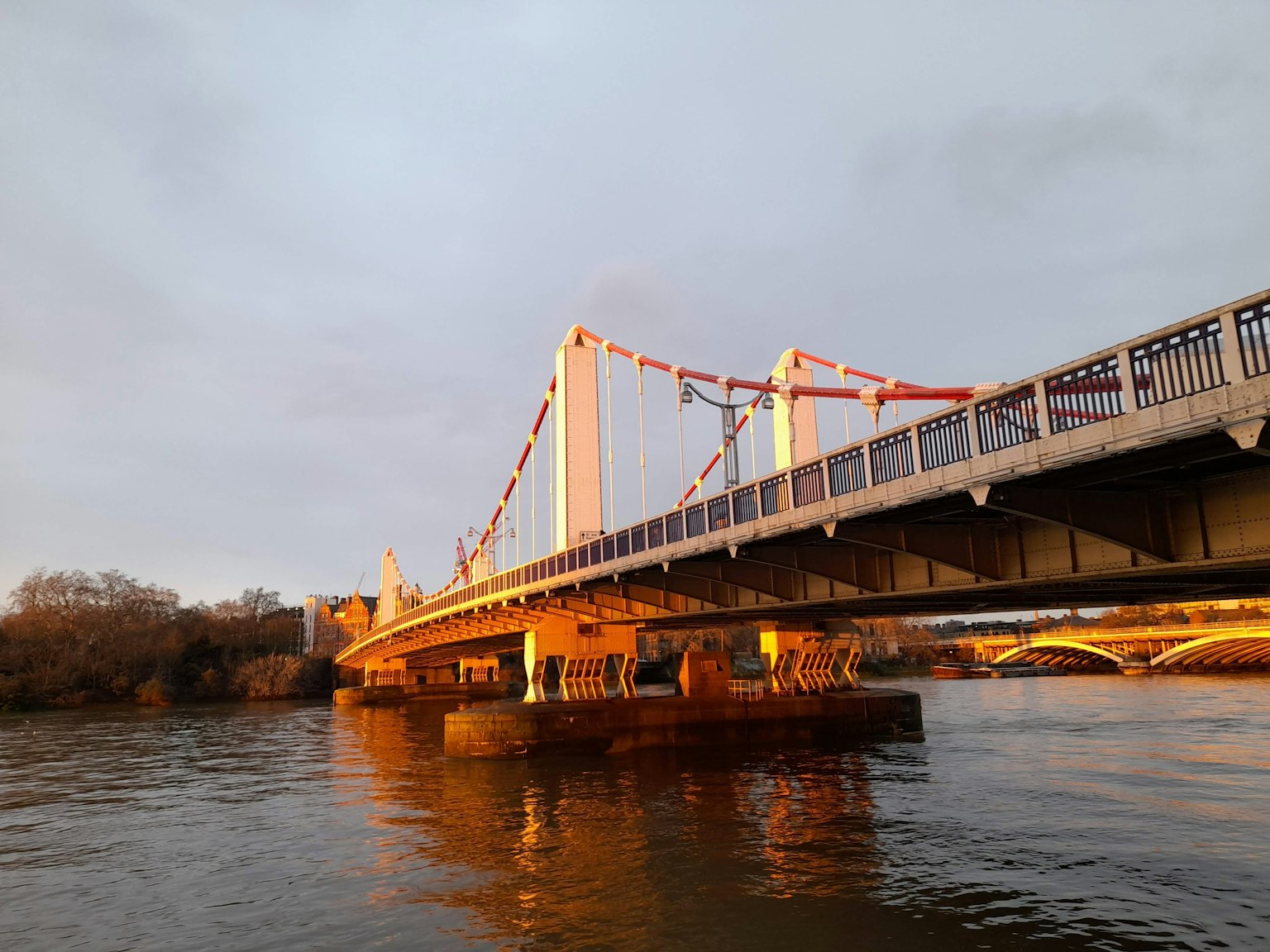 Bridge at sunset with calm water underneath