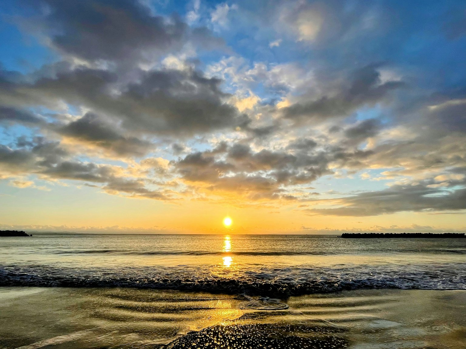 Beautiful sunset over the ocean with clouds