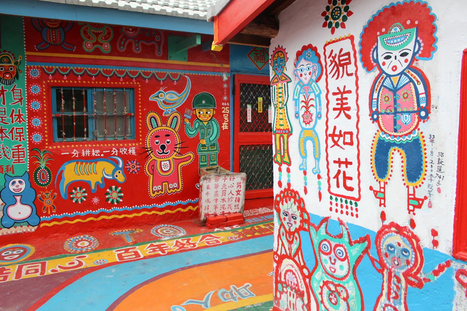 Colorful murals on houses in a vibrant artistic village