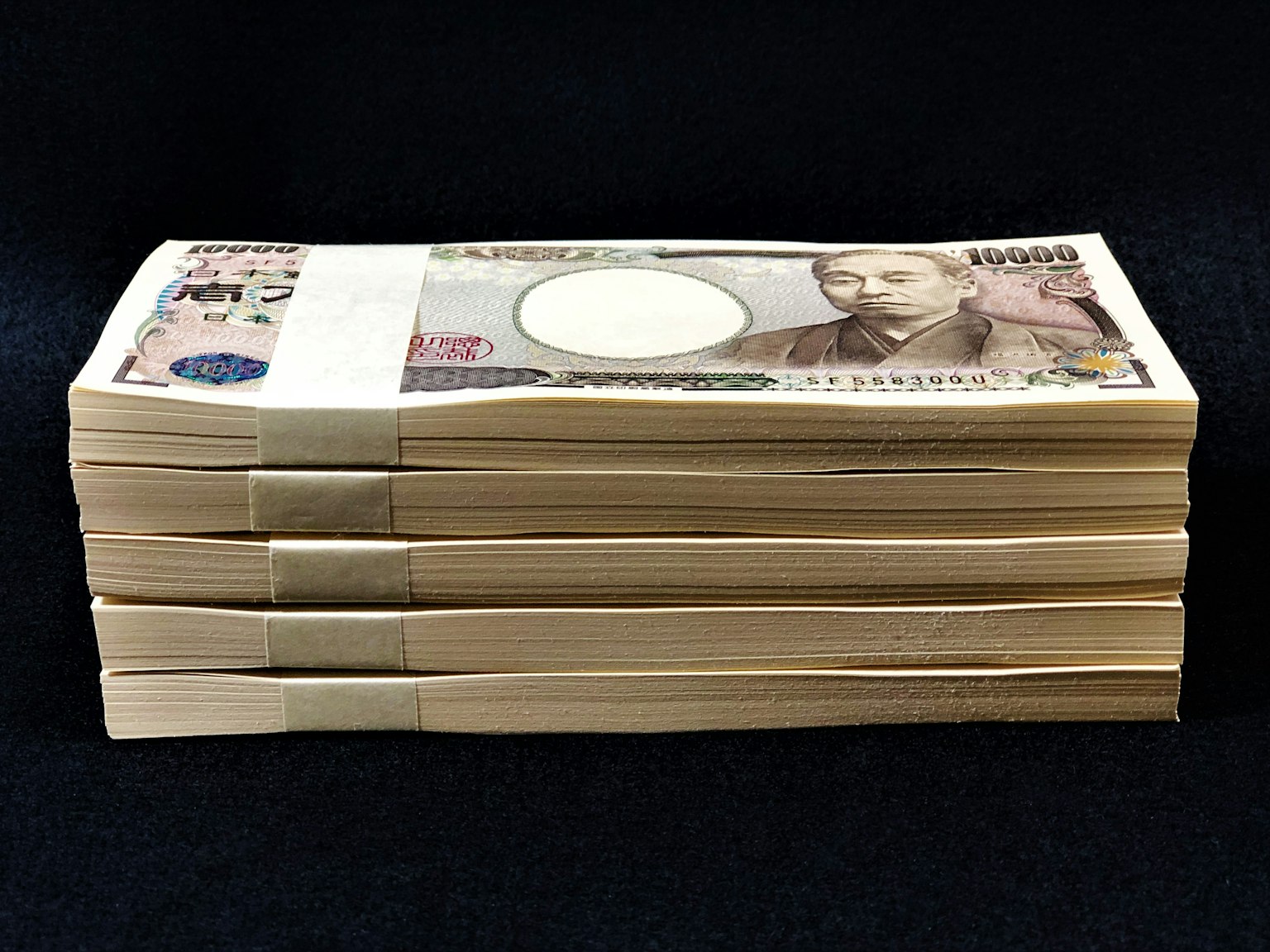 Stack of bundled Japanese yen banknotes