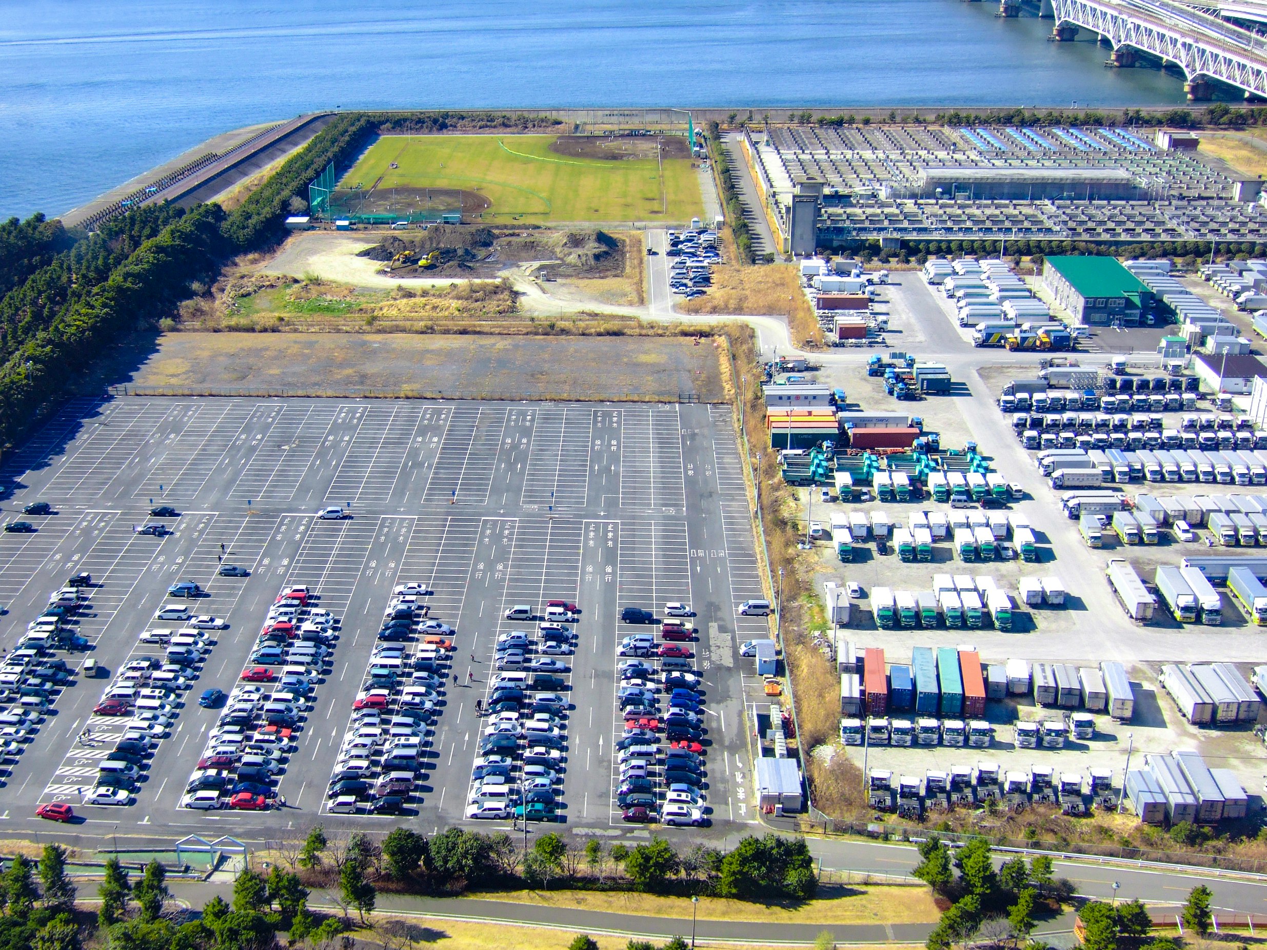 A large parking lot with solar panels on the site