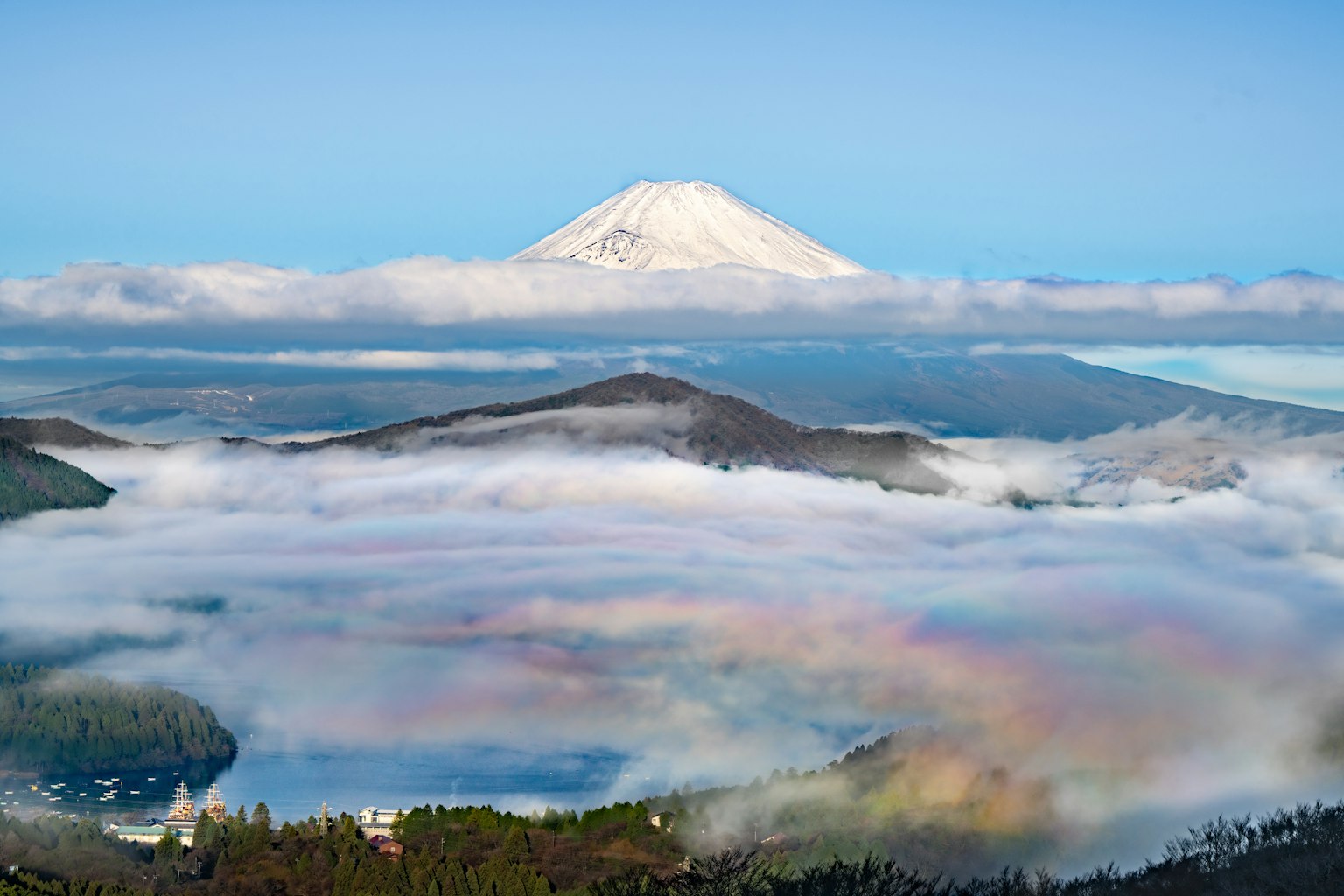 Mount Fuji towering above clouds in a stunning landscape
