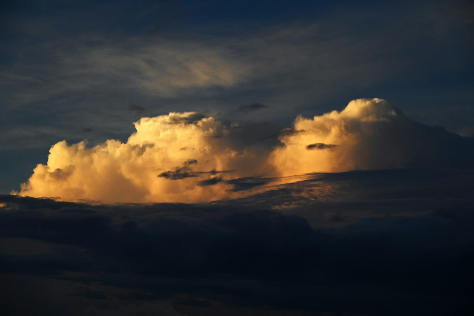Clouds illuminated by orange light during twilight