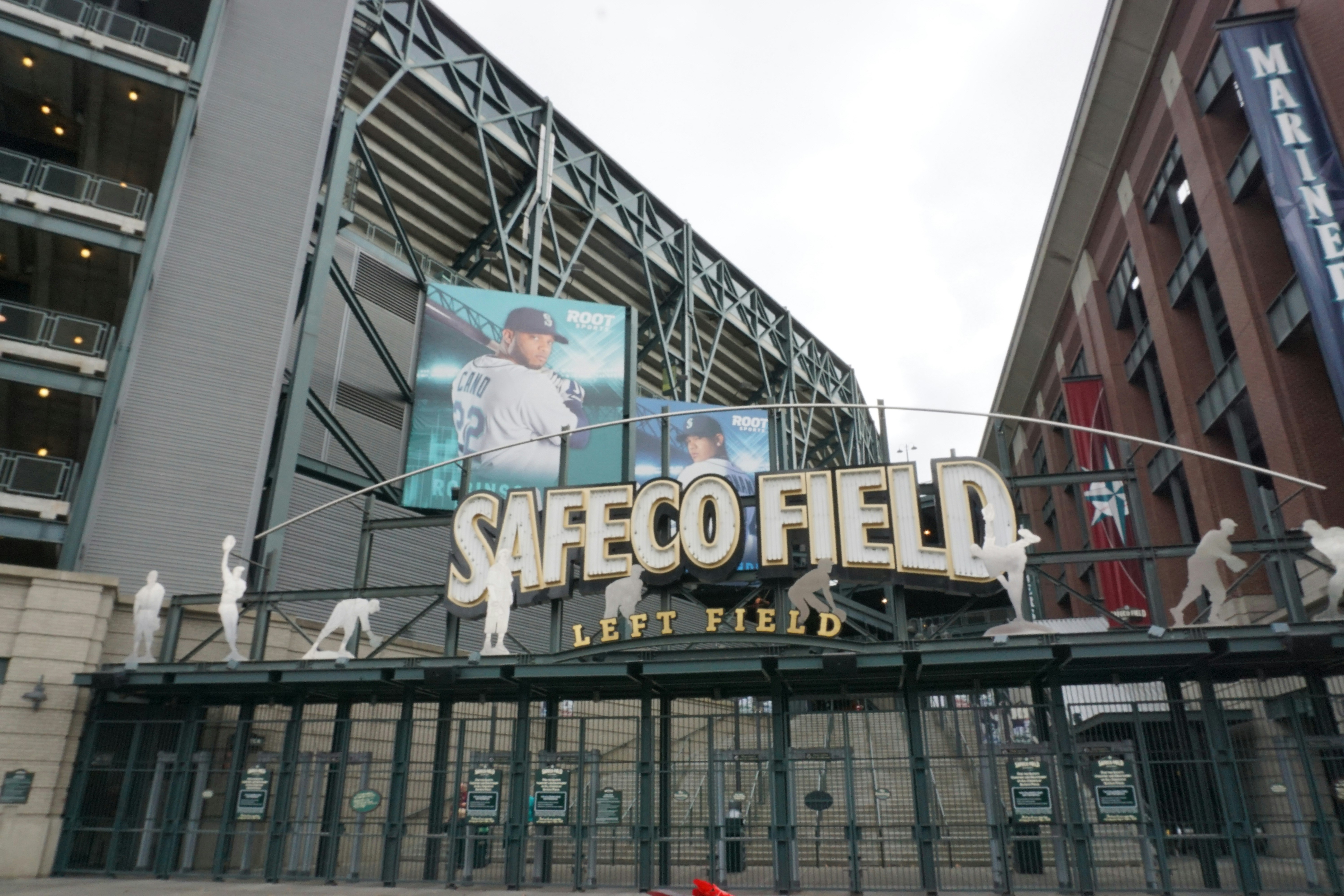 stadium entrance with large marquee signage and seating beyond