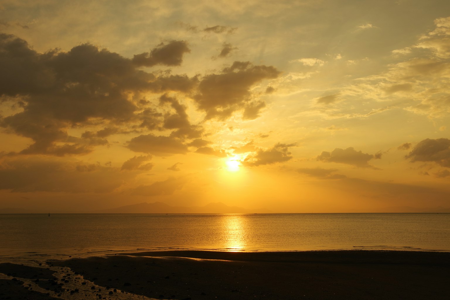 Beautiful sunset over the ocean with golden hues
