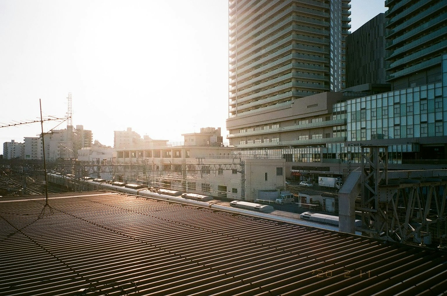 Urban landscape with sunset light high-rise buildings and train tracks