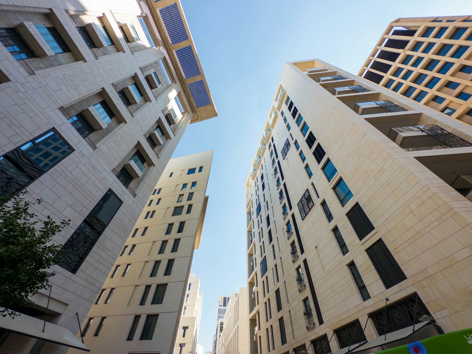 Urban landscape viewed from ground level between tall buildings