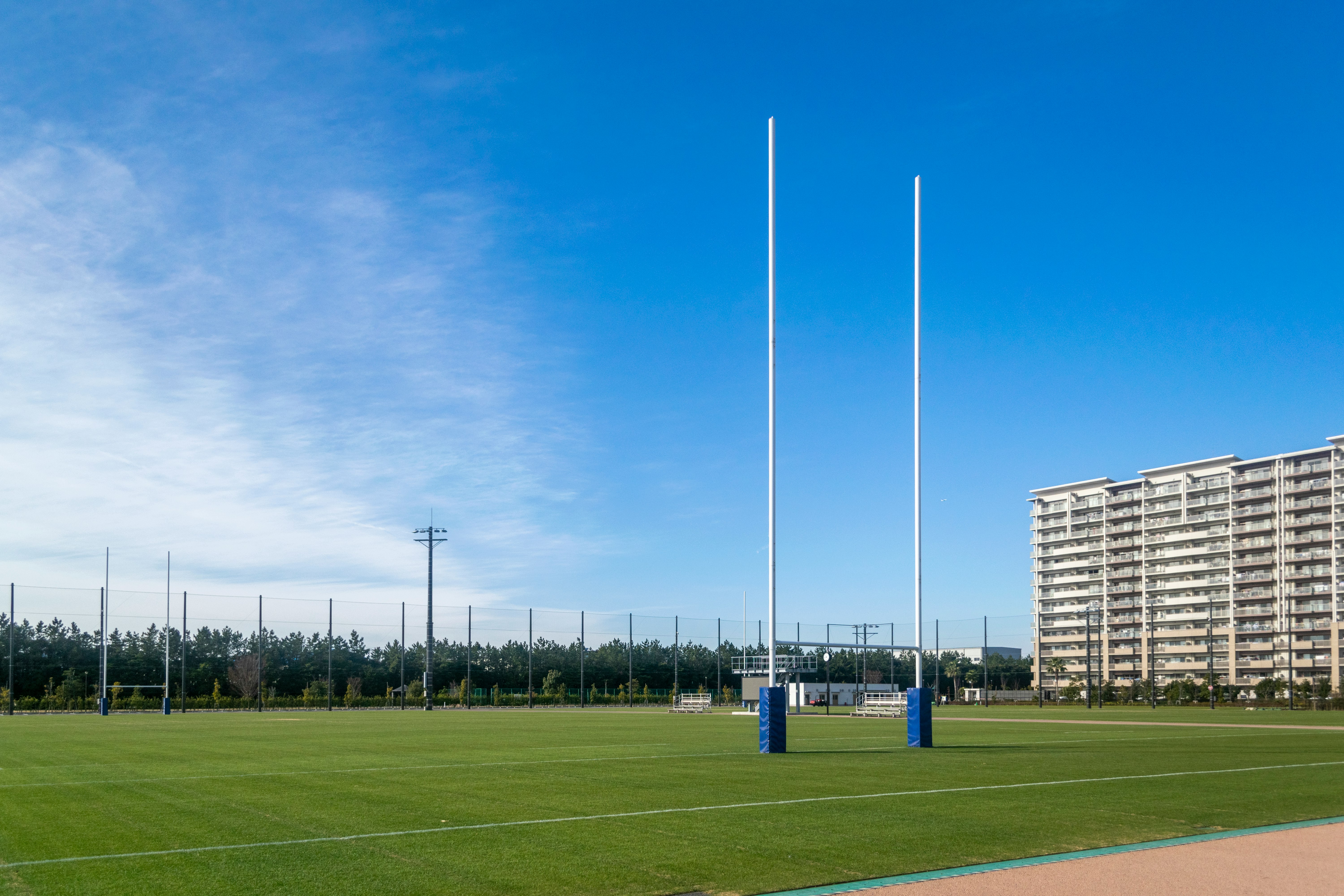 soccer field and goal under a blue sky