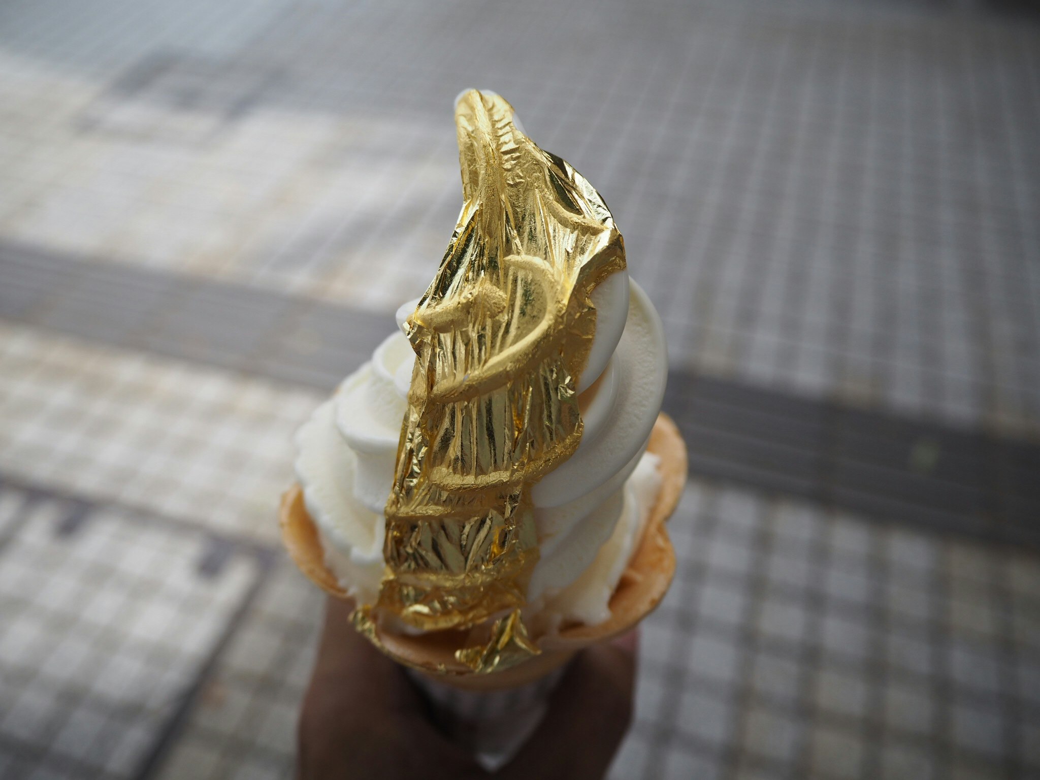 slice of cake with a gold decorative topper
