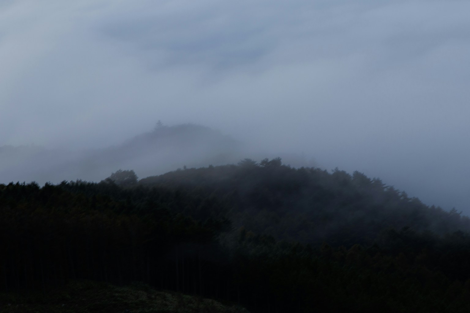 Misty landscape with mountains shrouded in fog
