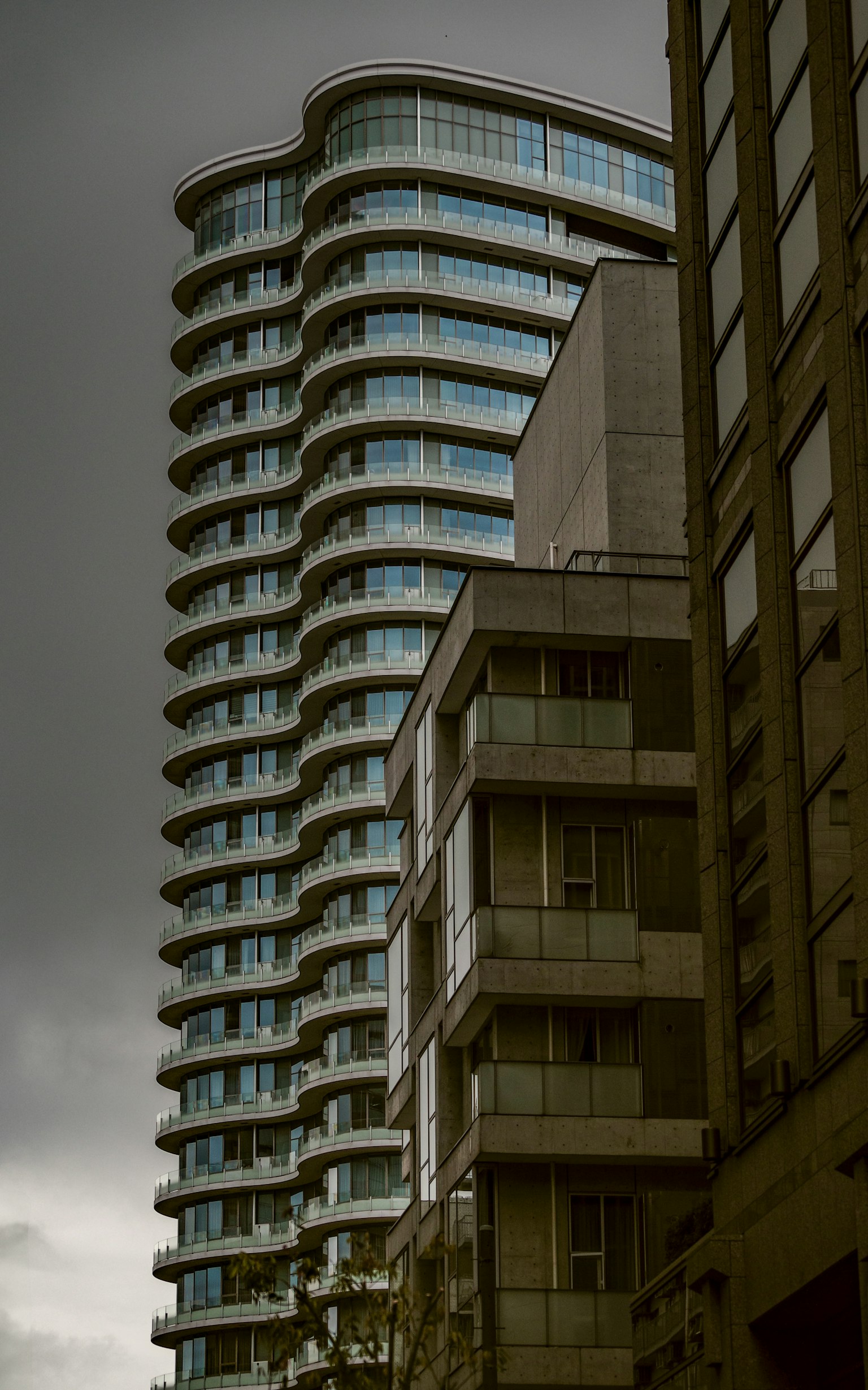 Urban landscape featuring a modern skyscraper and surrounding buildings