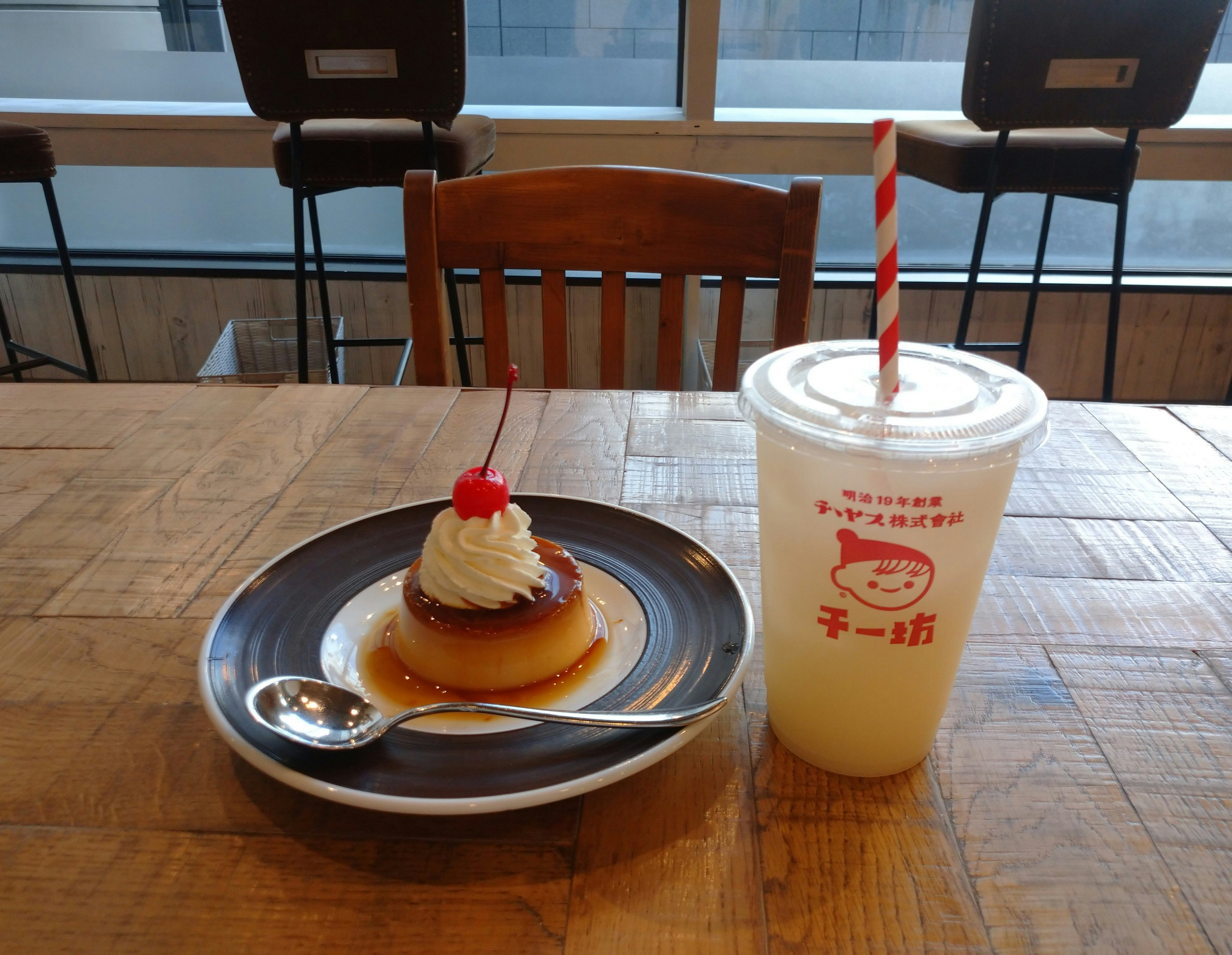 Pudding and a drink on a café table image