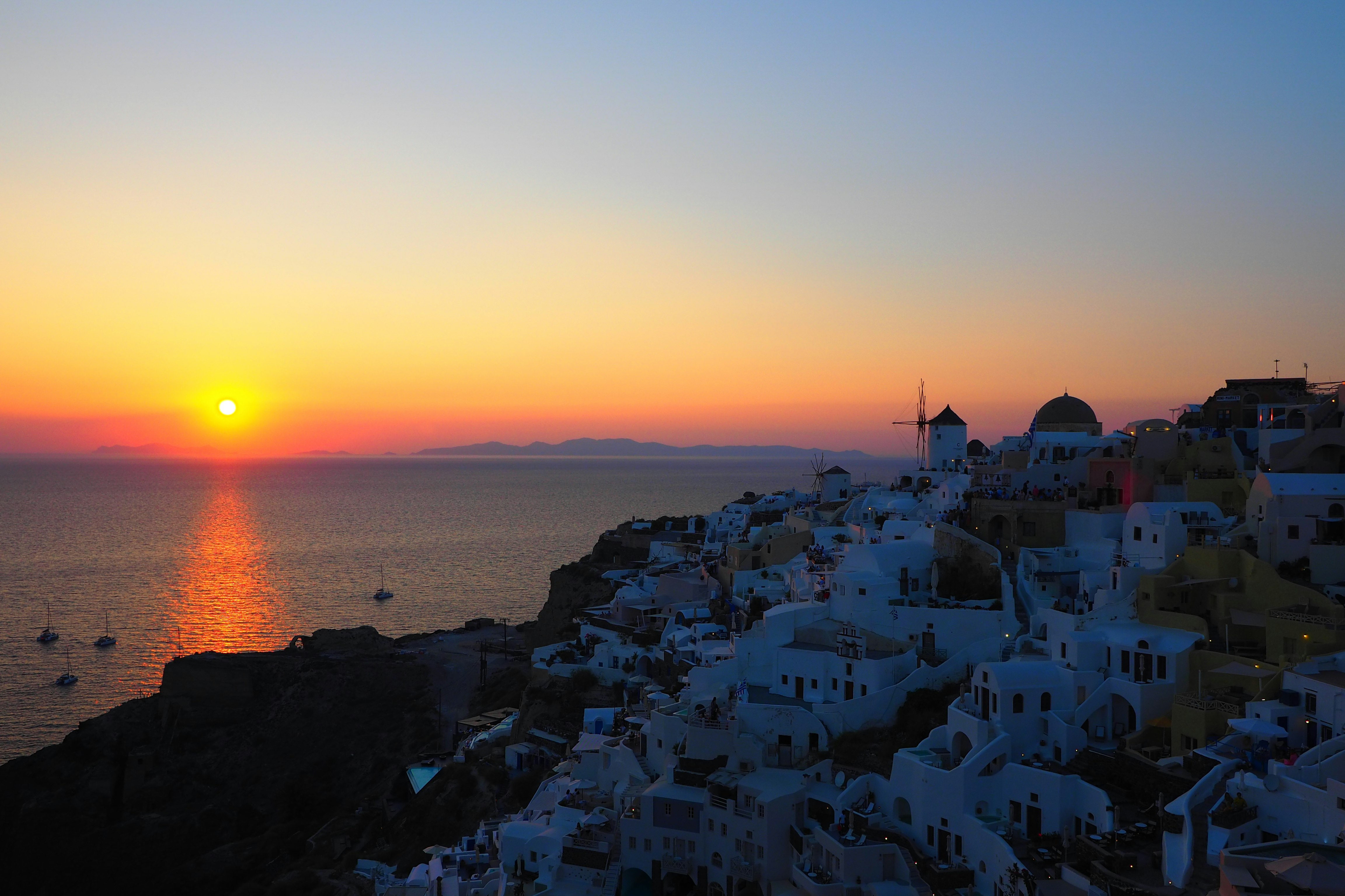 Beautiful sunset over Santorini with white buildings