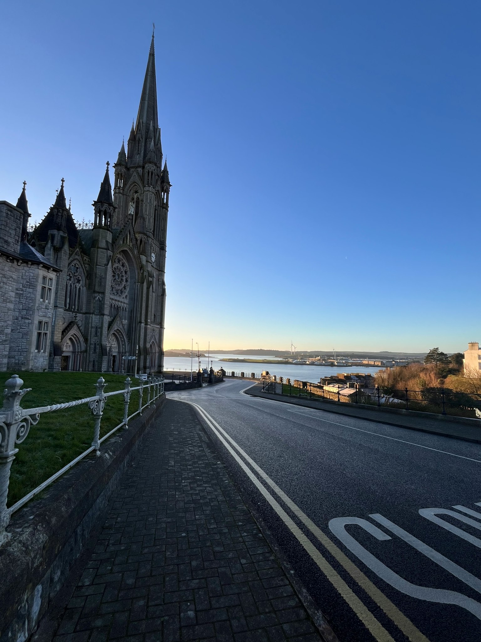 Church exterior with a scenic view of the sea and blue sky
