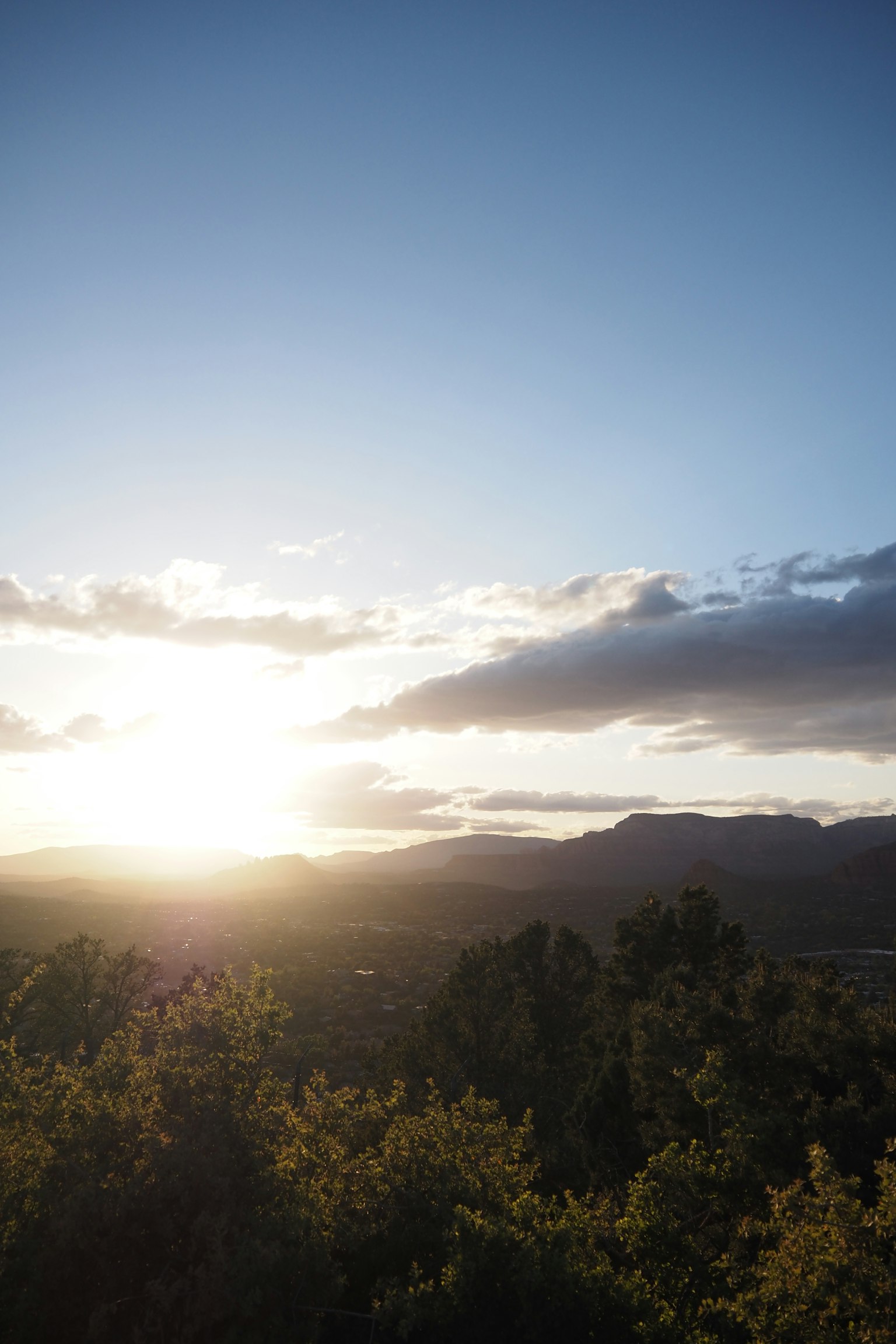 Beautiful landscape with sunset rising between mountains