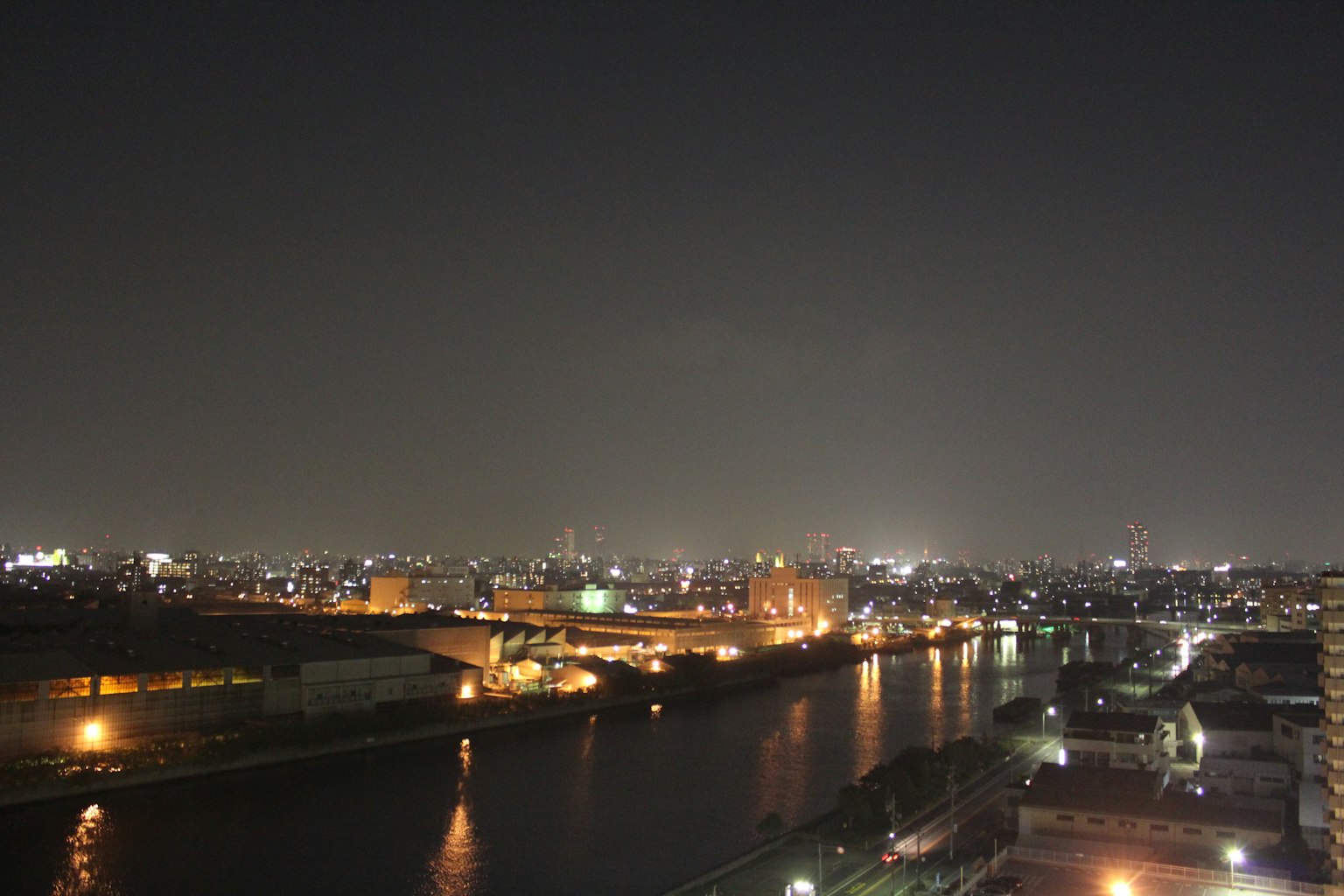 Nighttime cityscape with river reflections