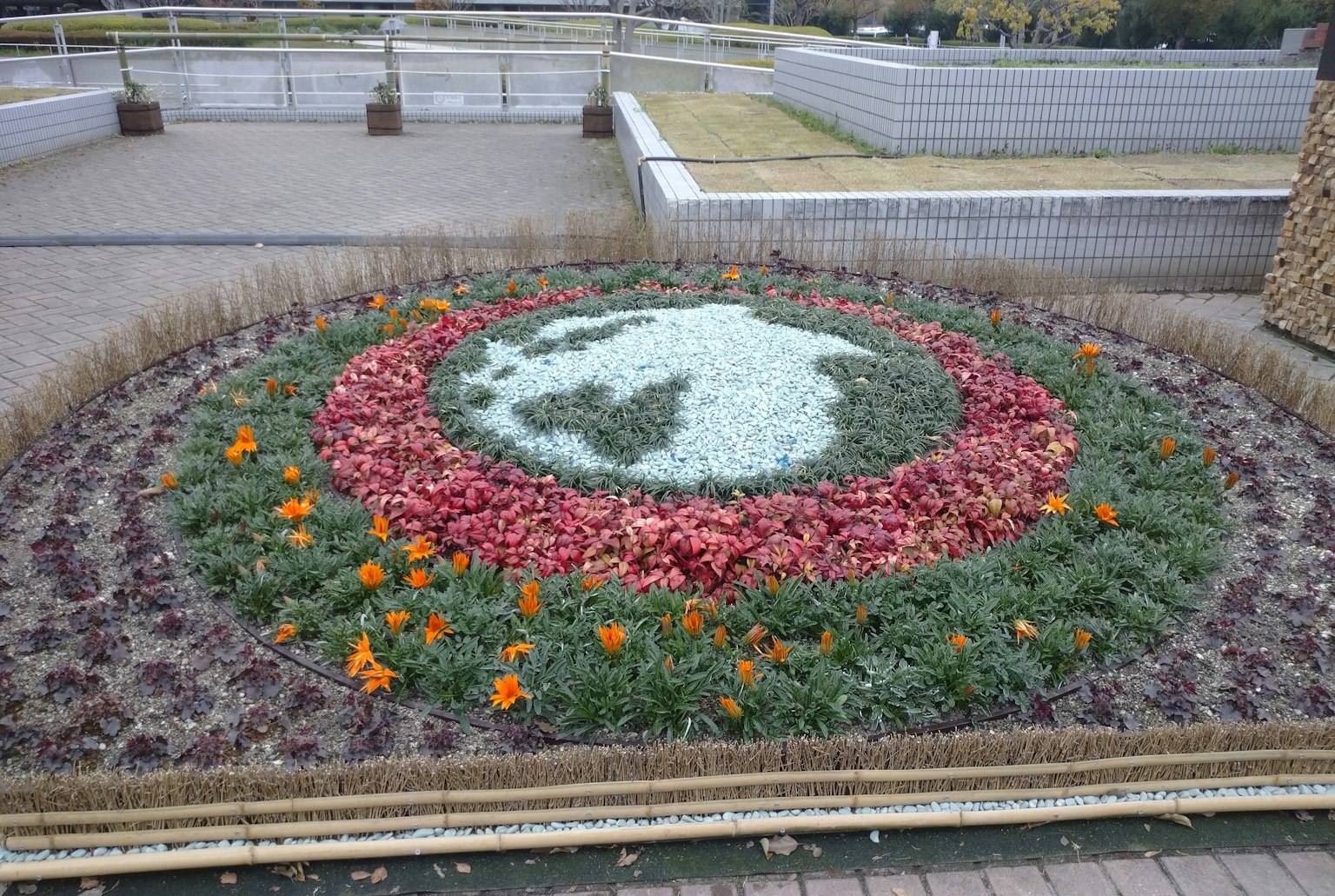 Flower bed designed in the shape of the Earth with colorful flowers