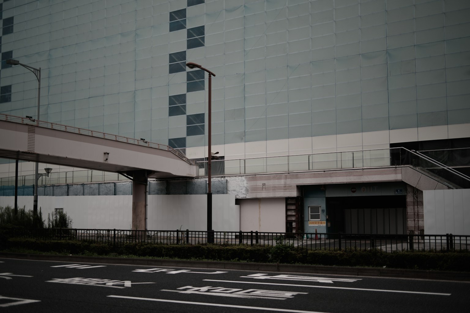 Urban landscape featuring a building exterior and a pedestrian bridge