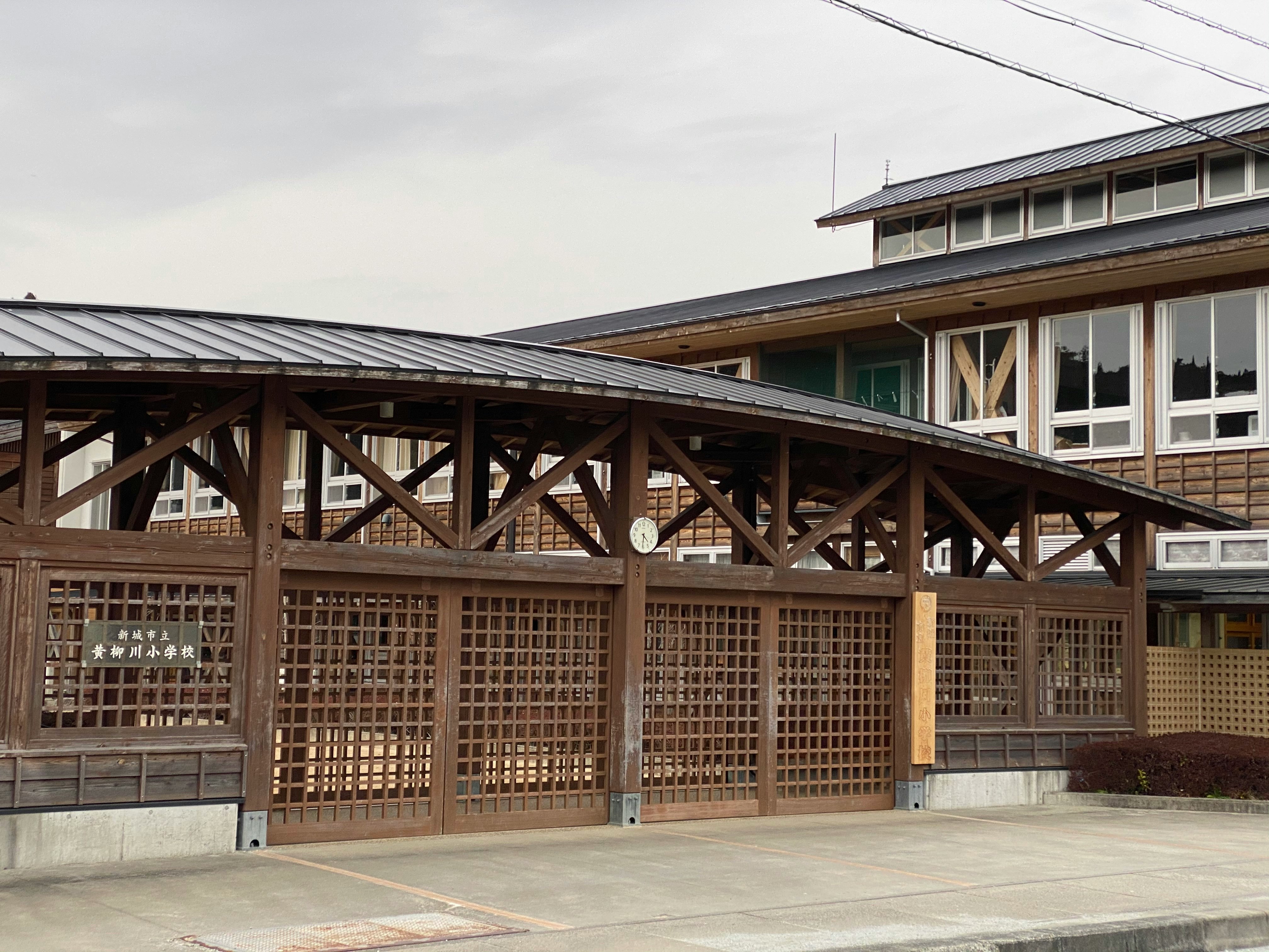 Exterior of a wooden lattice-roofed building