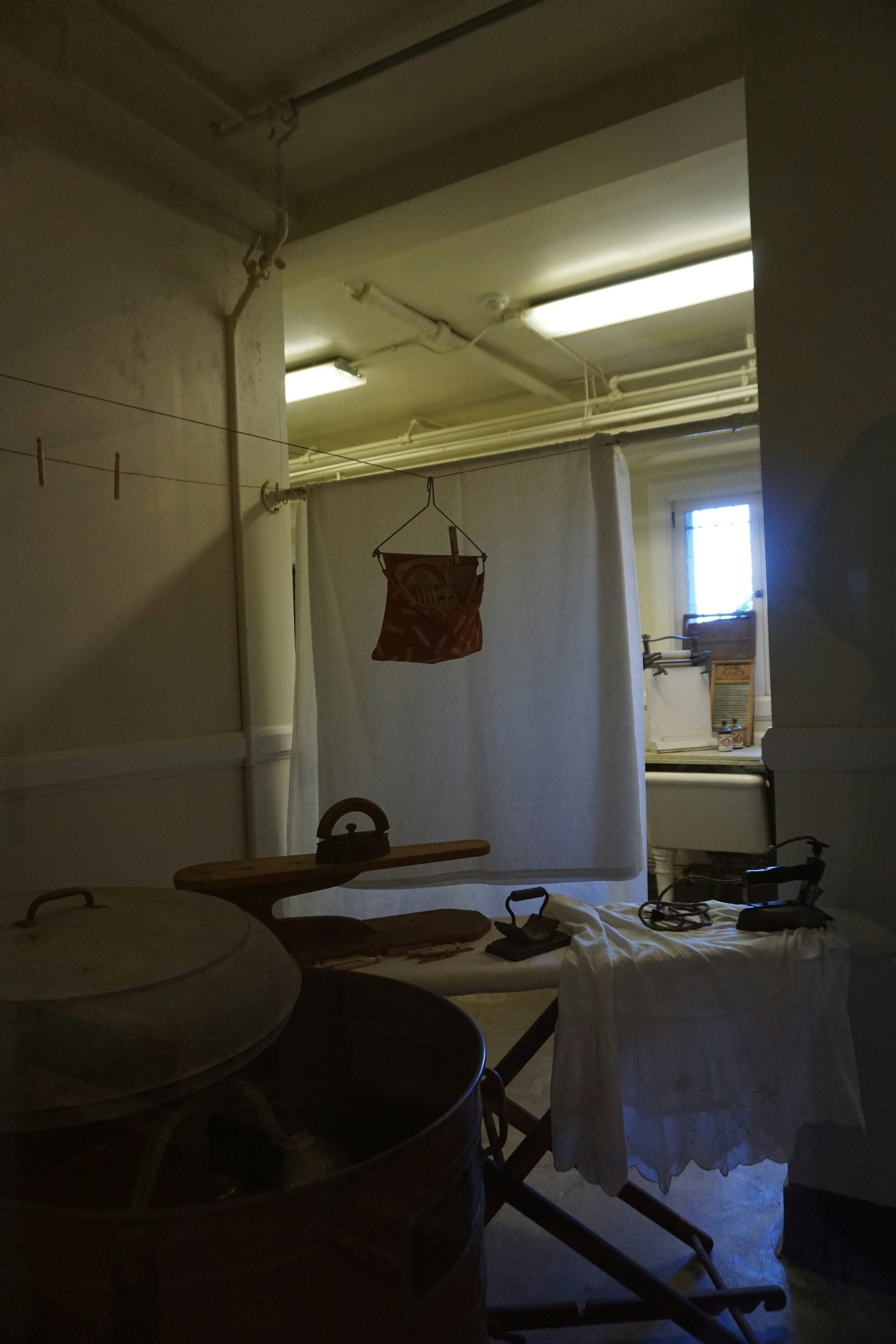 workbench and equipment inside a white-walled storage room