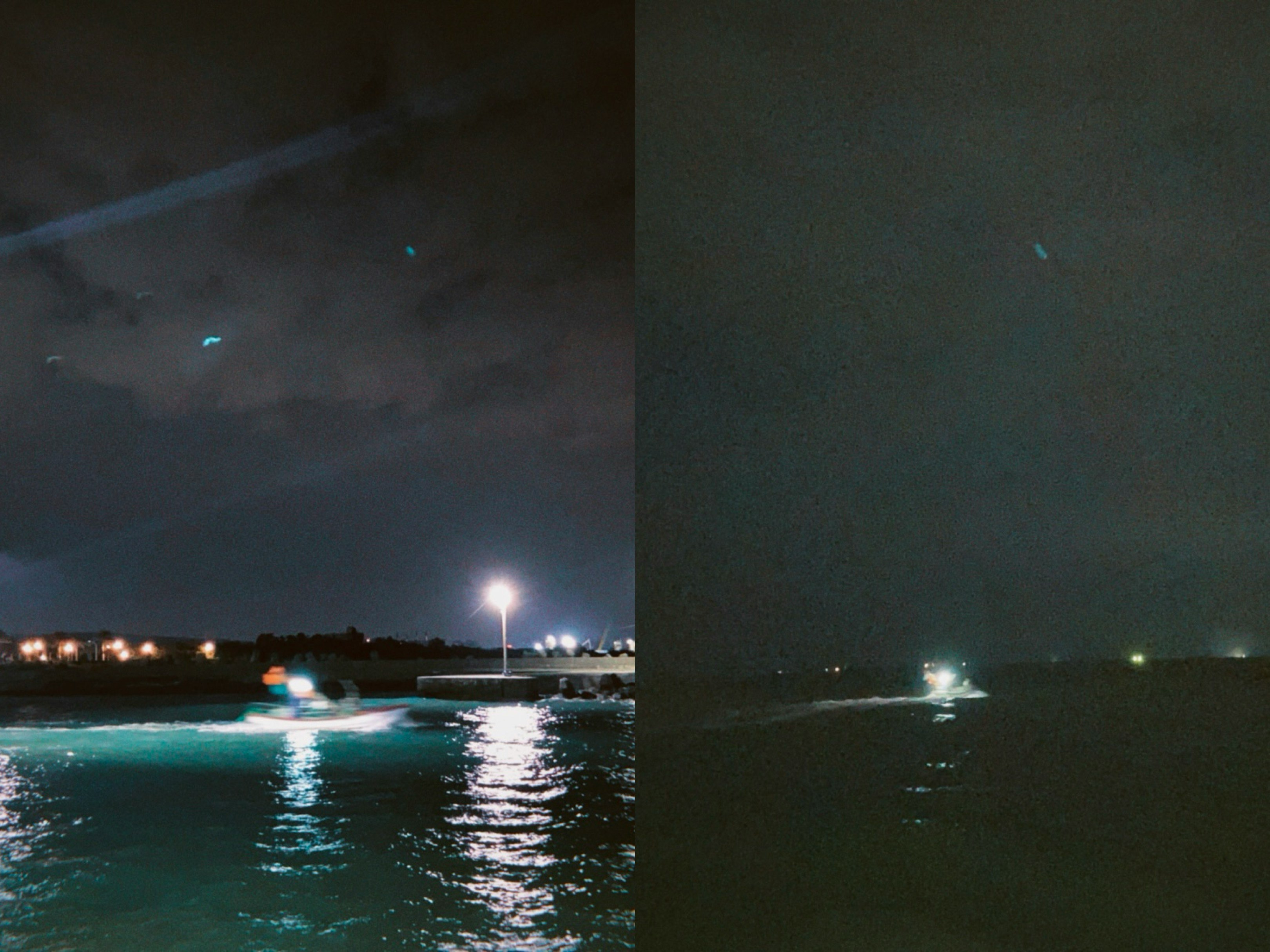 夜の海辺で光が反射する水面と岸の景色