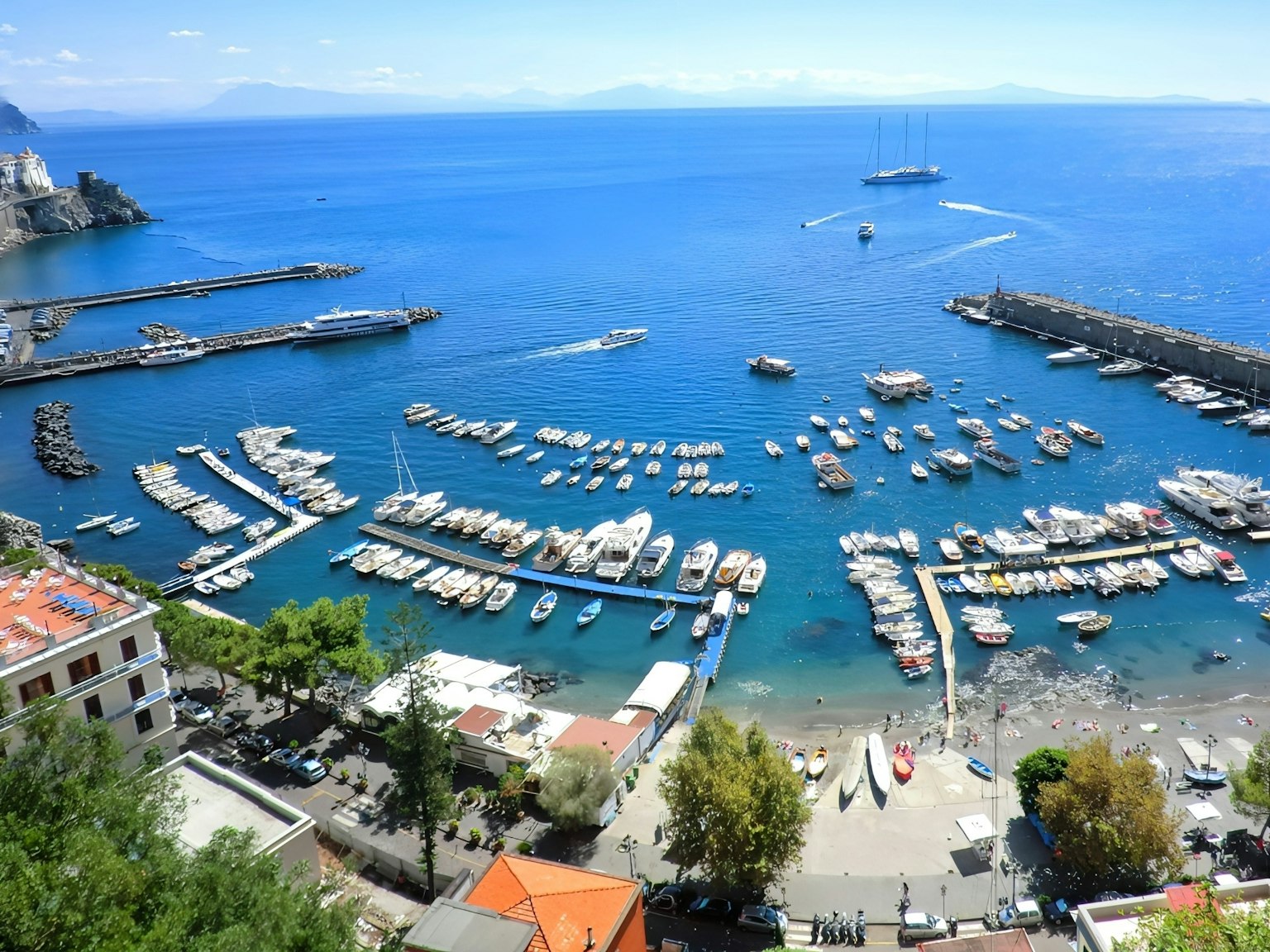 Scenic view of a harbor with boats in a blue sea