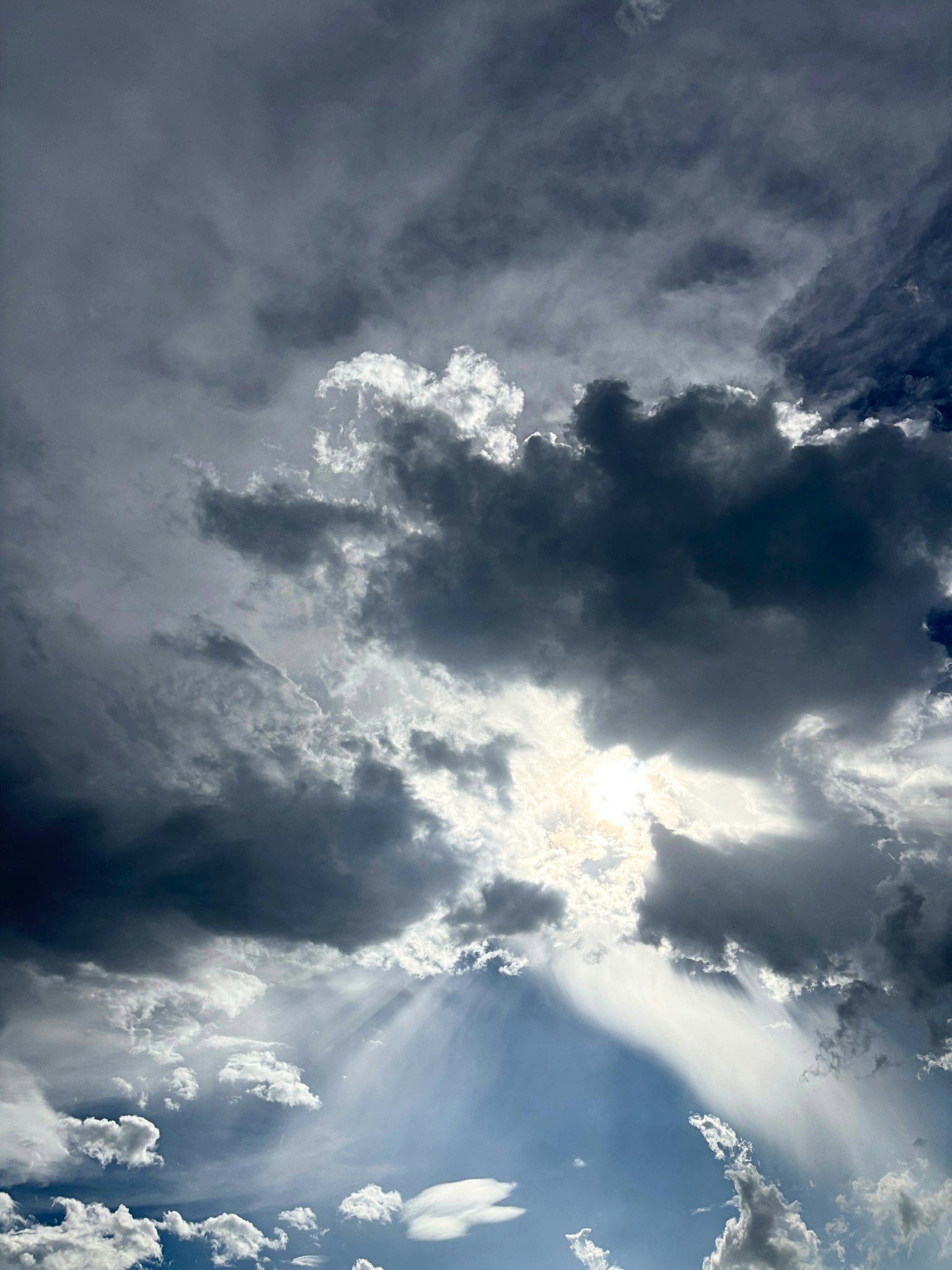 Dramatic sky with clouds and rays of sunlight