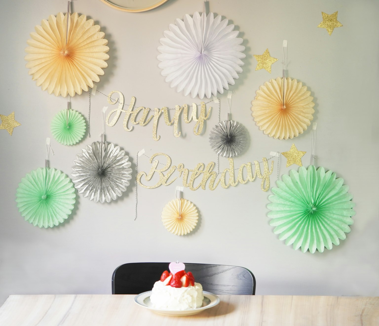 Colorful birthday decorations with a cake on the table