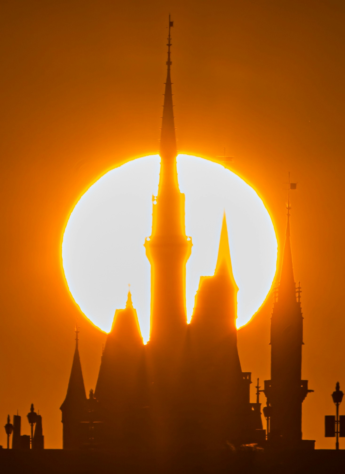 sunset silhouette of temple spires against a glowing sky