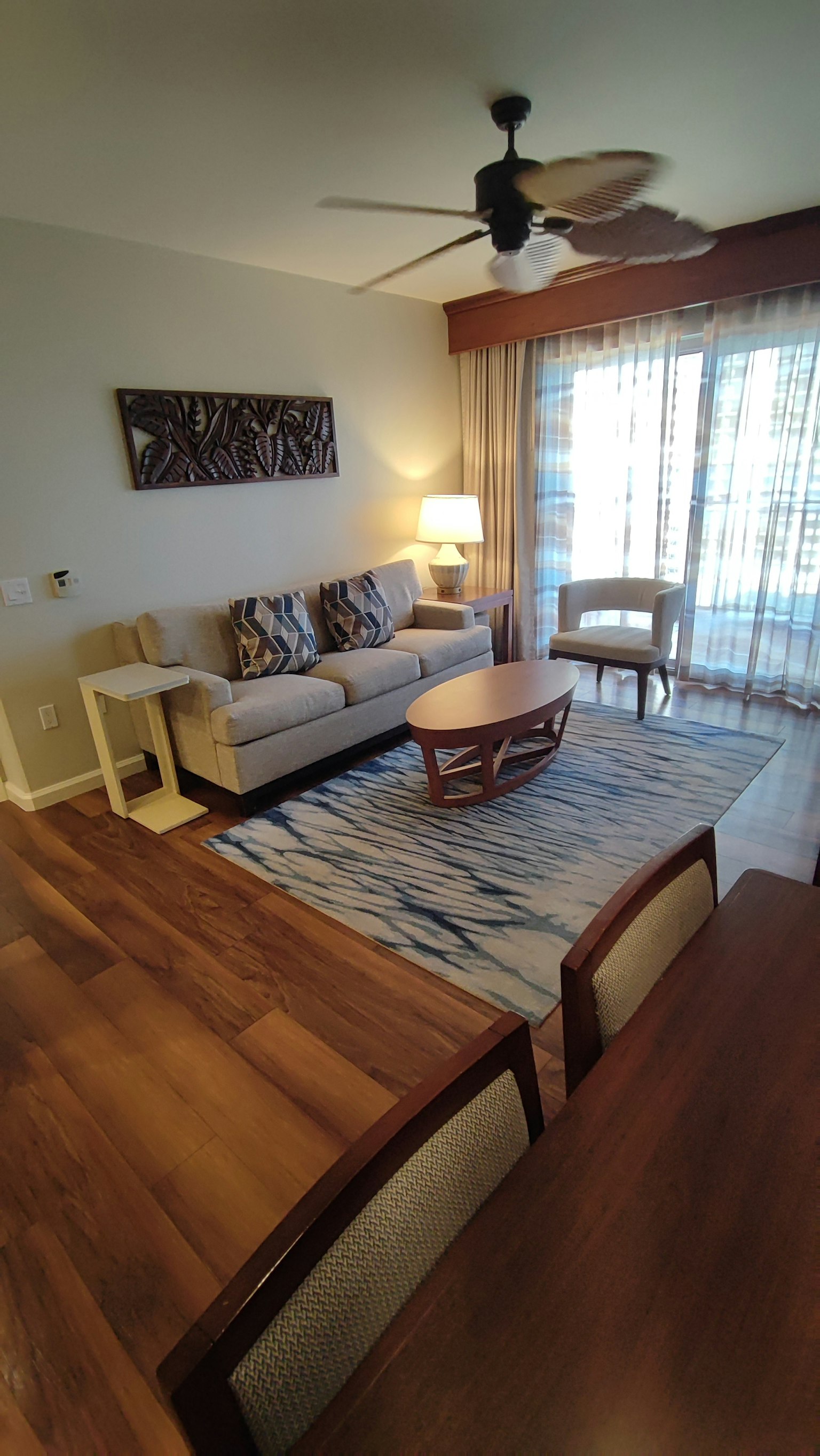 Bright living room interior featuring wooden flooring and cozy furniture